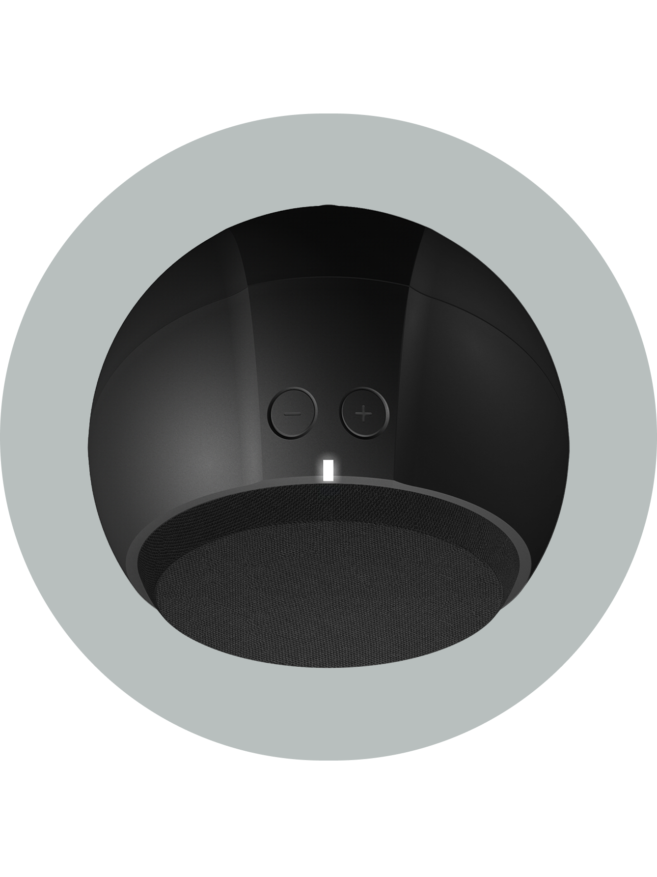 The top of a black speaker, showing a powered-on indicator light and volume controls