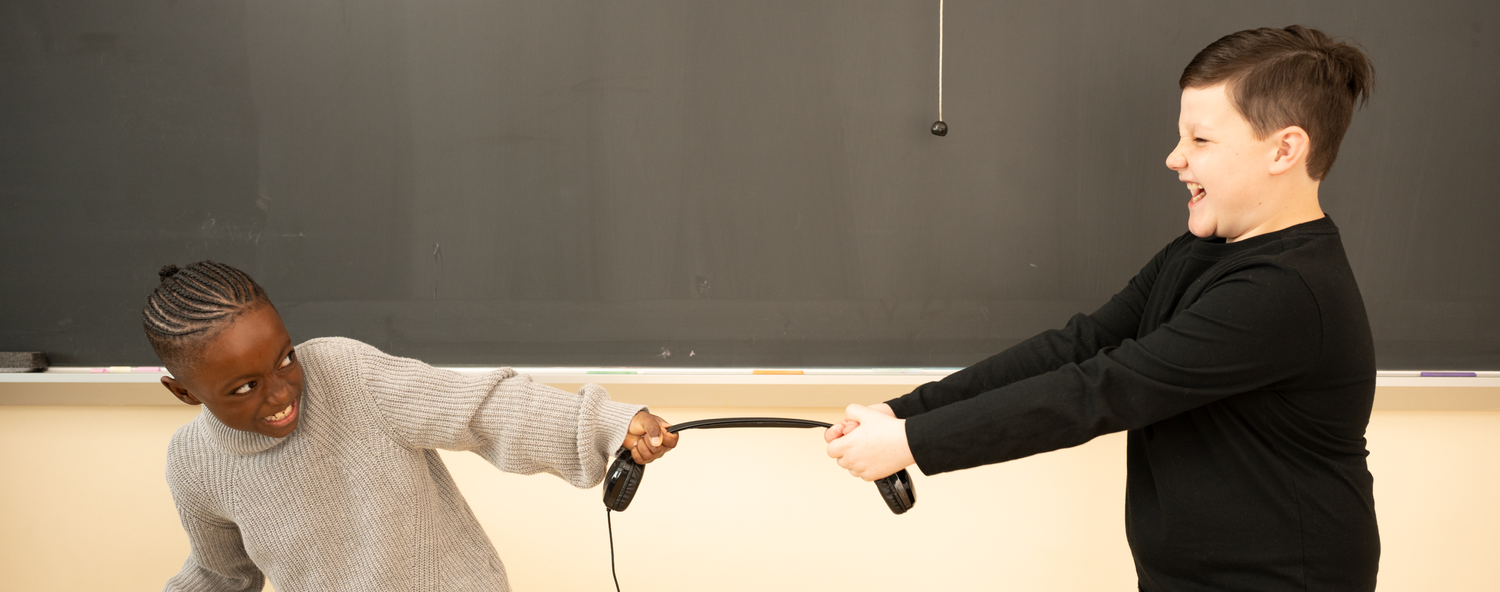 A headset headband being bent and twisted to show durability