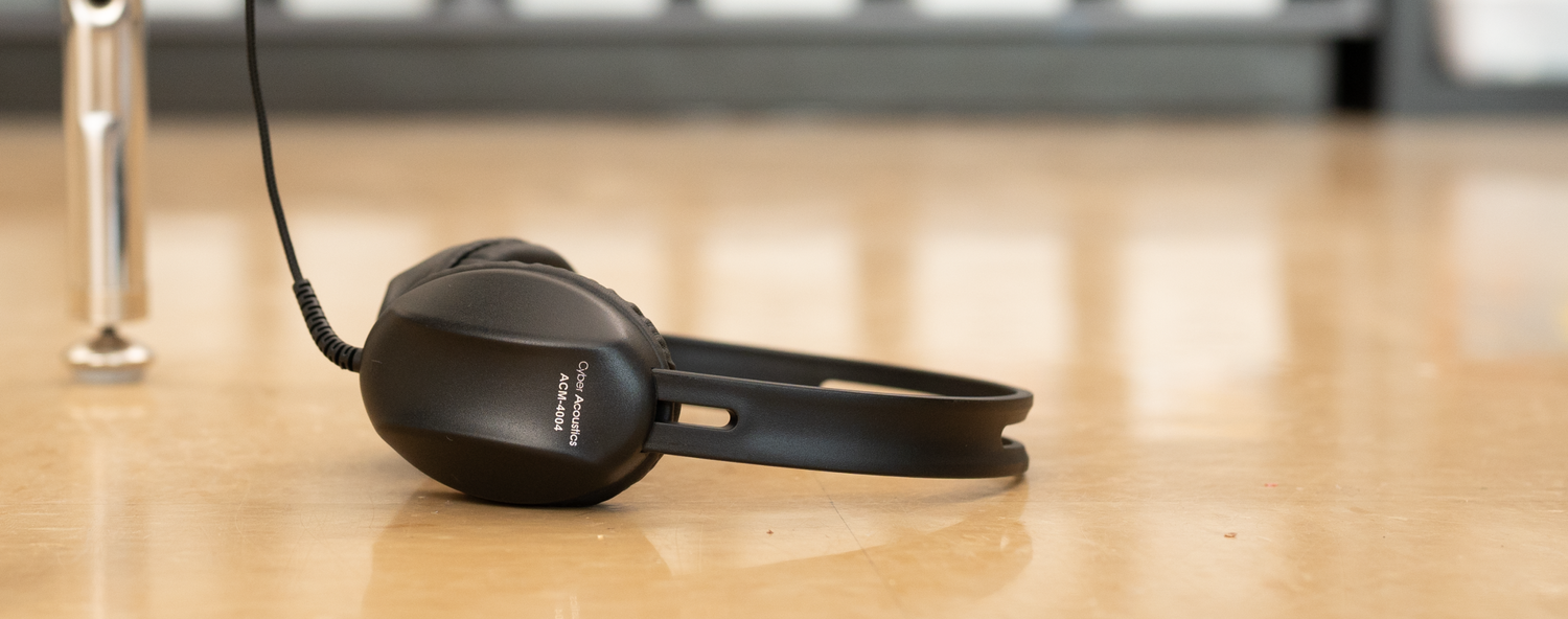 Leatherette ear cushions being wiped clean