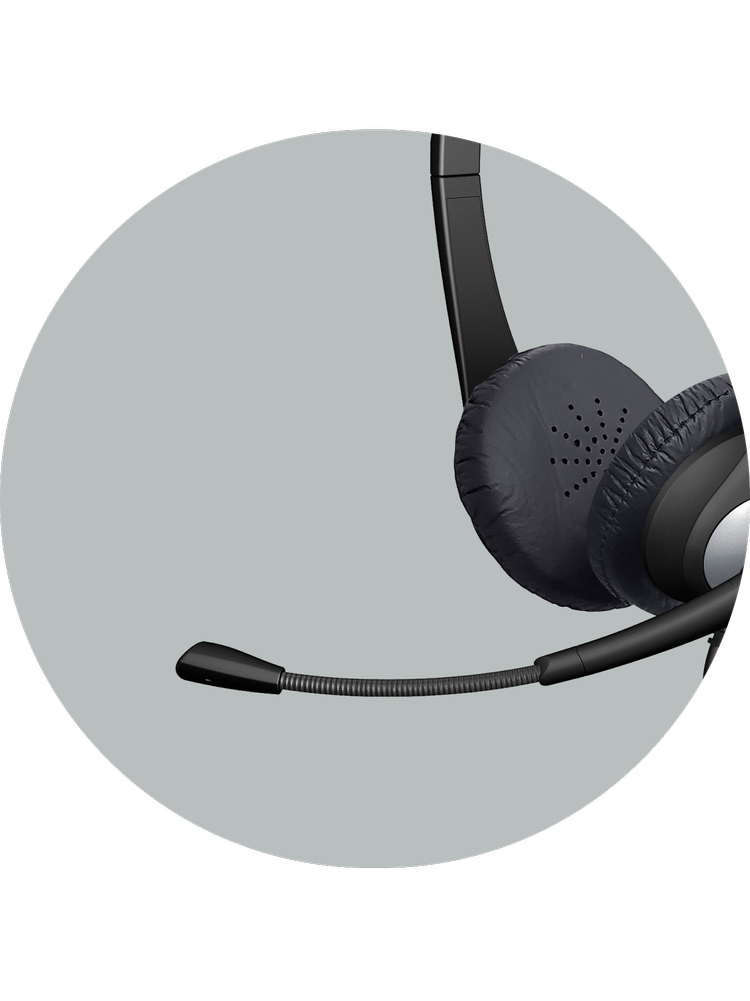 Close-up of the AC-204 headset's unidirectional boom microphone and earcup, designed to minimize surrounding background noise