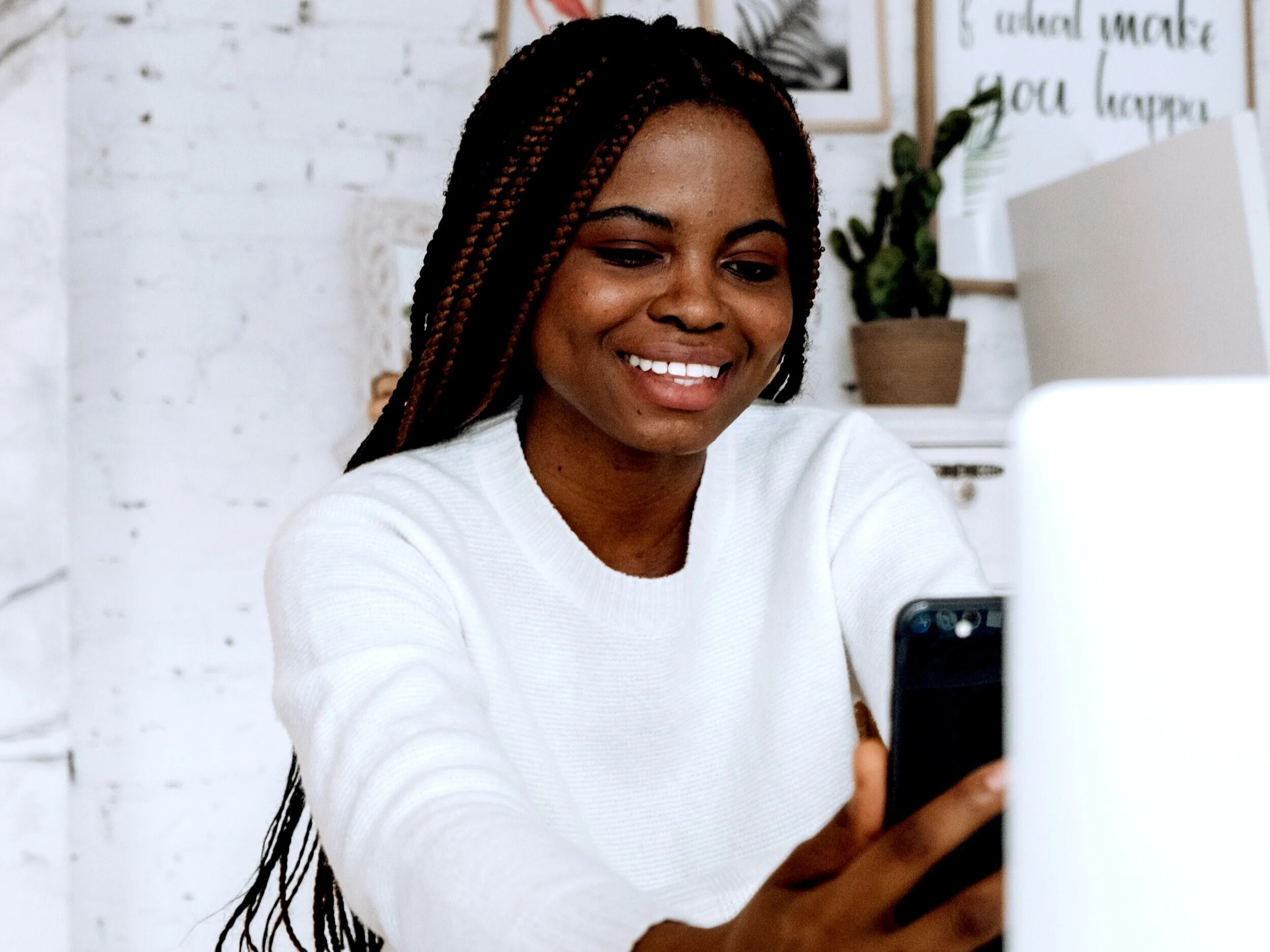 exploratory call-woman holding cell phone on video chat.jpg