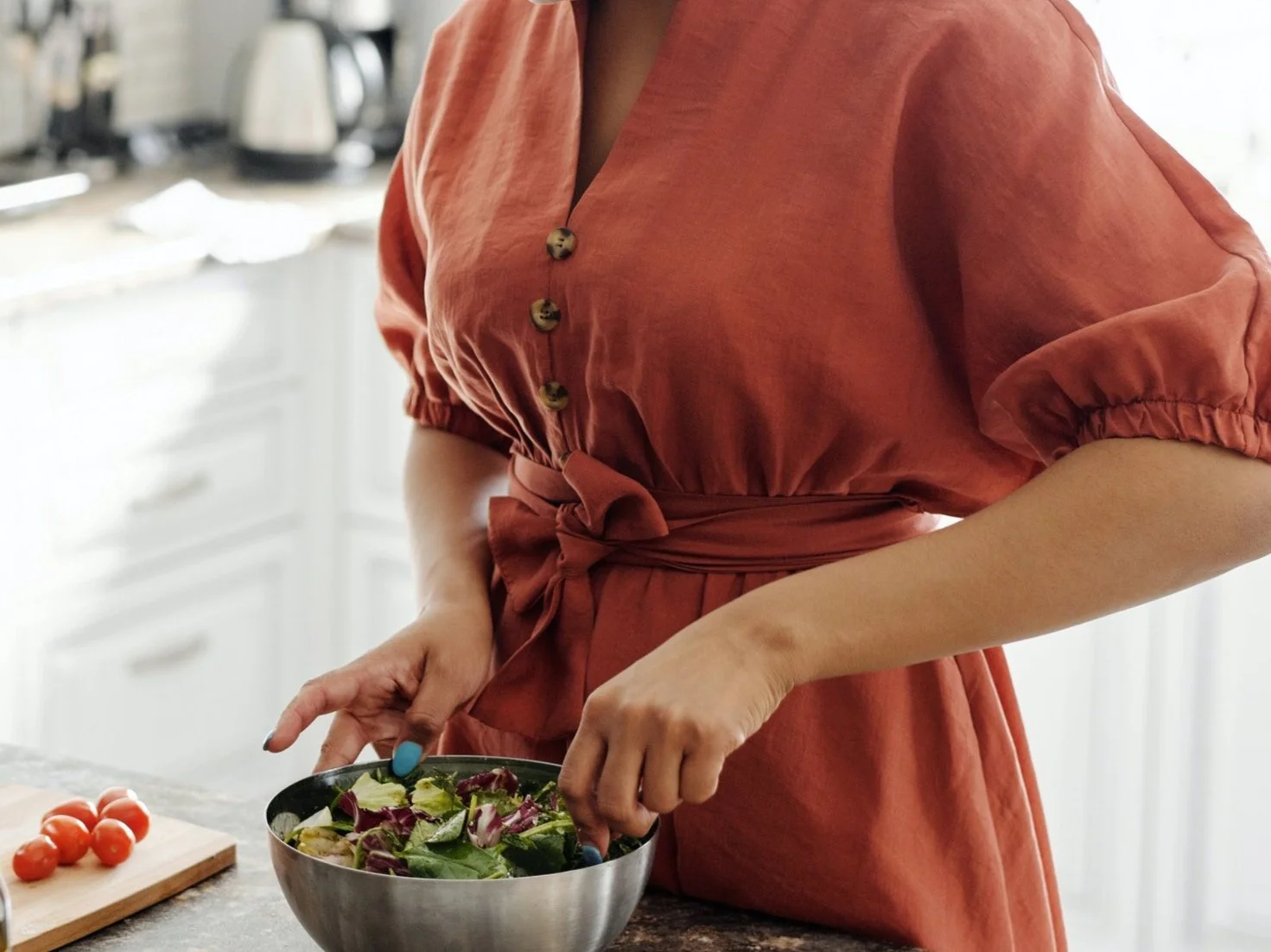 initial consult - woman making salad.jpg