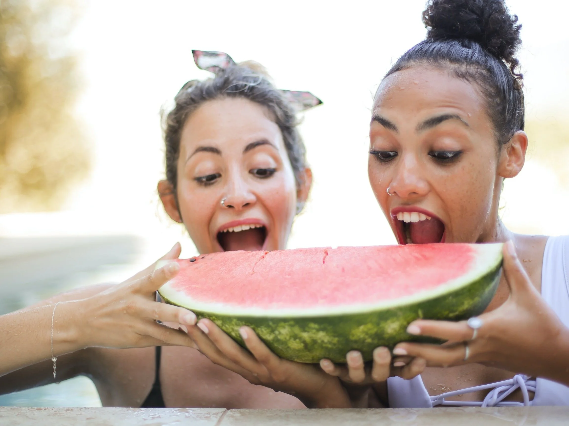Follow-Ups Two women eating watermelon.jpg