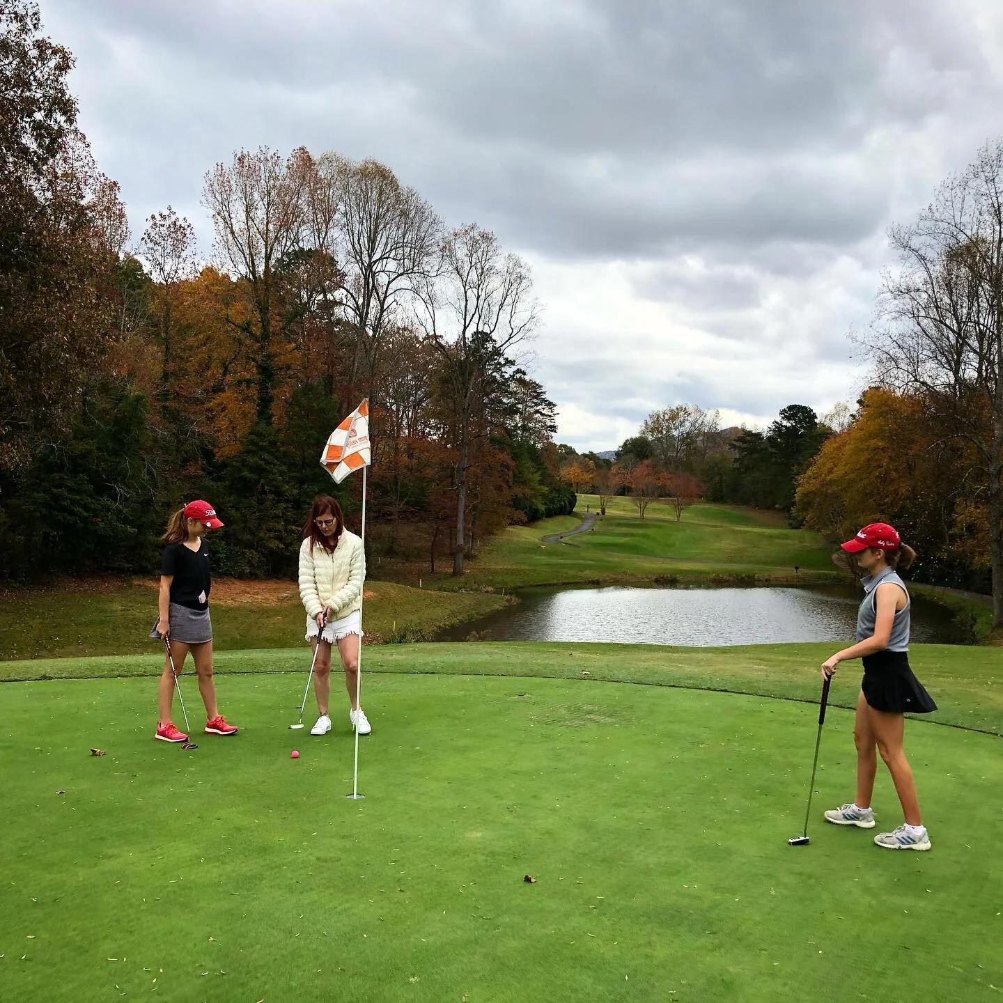 Belle generally comes out to the course, rides around in the cart, and listens to great music. This time she wanted to play. We brought an extra putter and she sank a few. We had a better day than most.