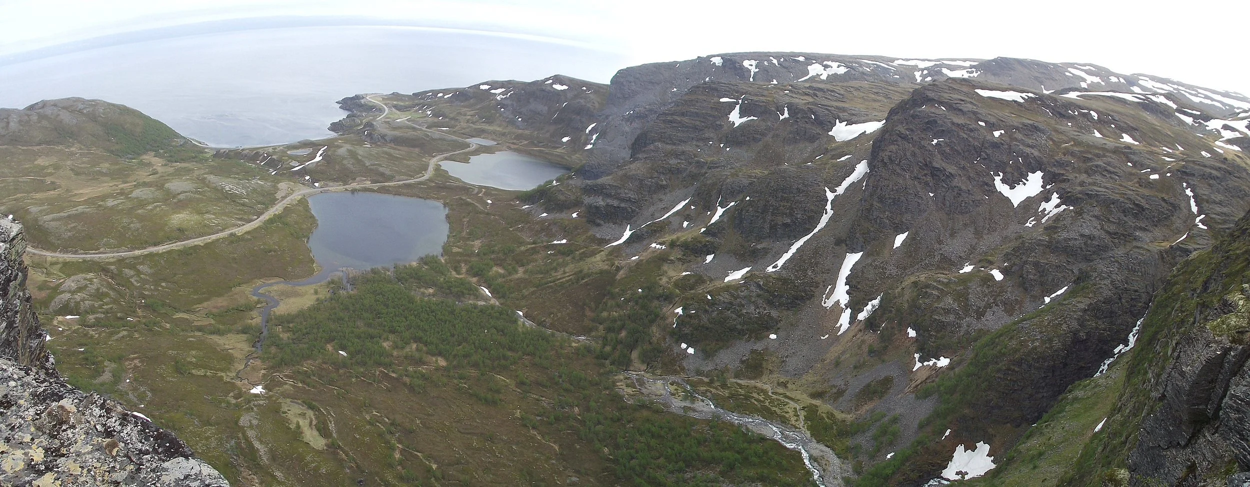View from the top of the escarpment behind Indre Sortvik towards Porsangerfjord, Finnmark, Norway.