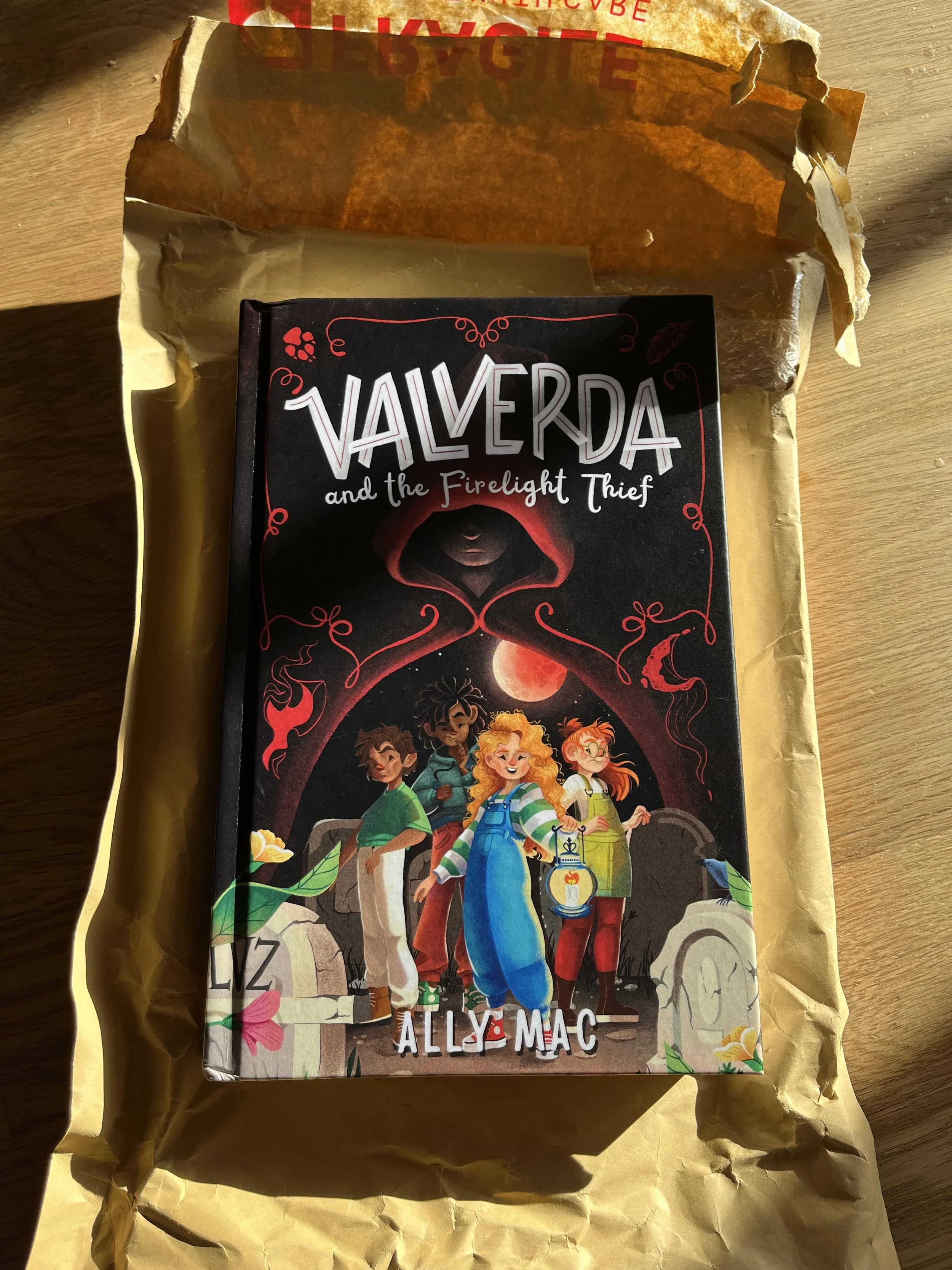 A copy of the children's book Valverda and The Firelight Thief which had just arrived in the post, resting on a jiffy bag. Annie narrates children, creature and adults voices for the audiobook..