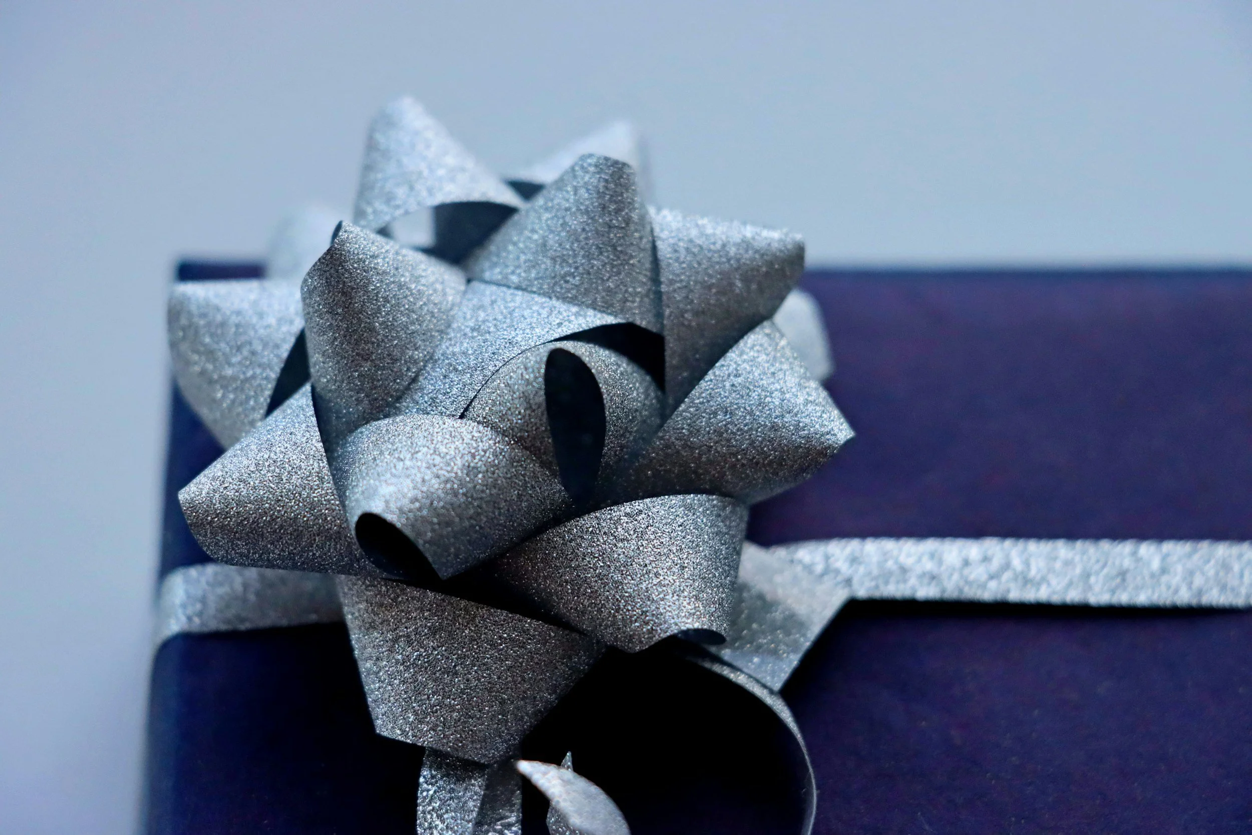 a blue gift with silvery bow