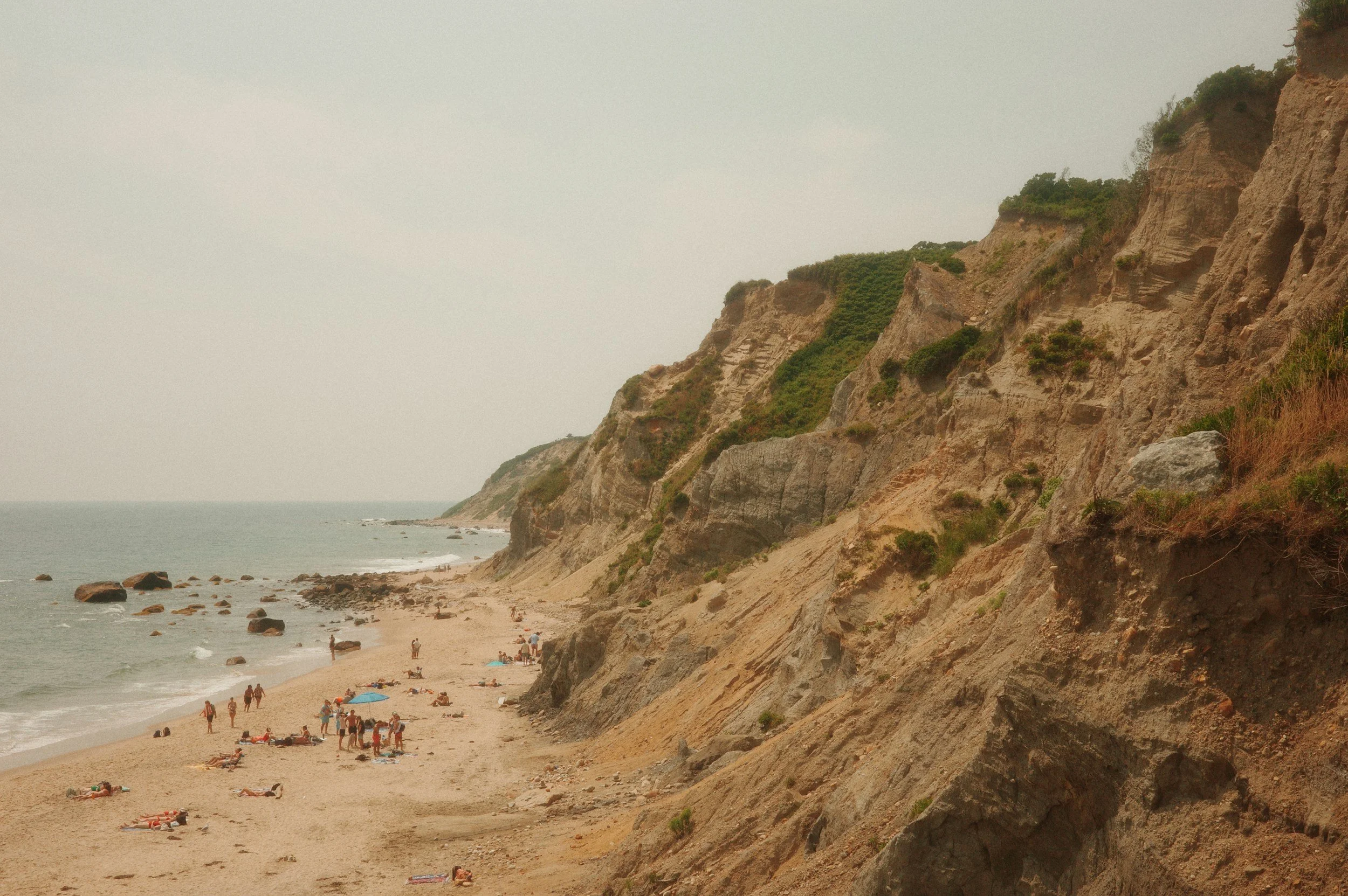 A beach at the base of cliffs