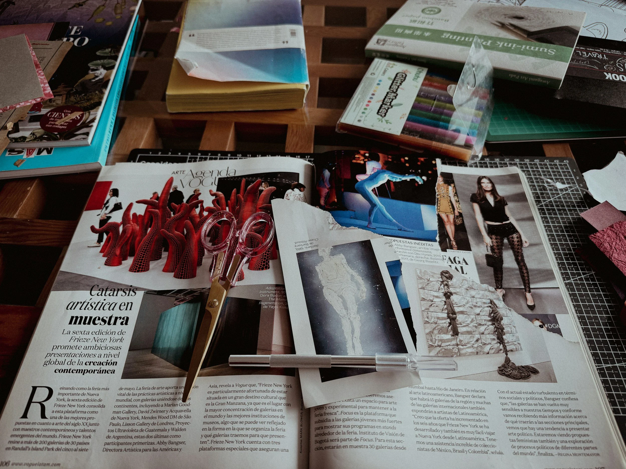 magazine and scissors, with pictures cut out