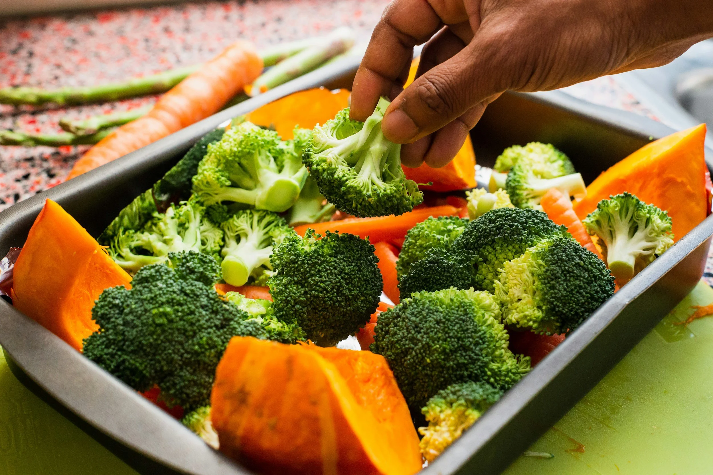Placing vegetables on a pan