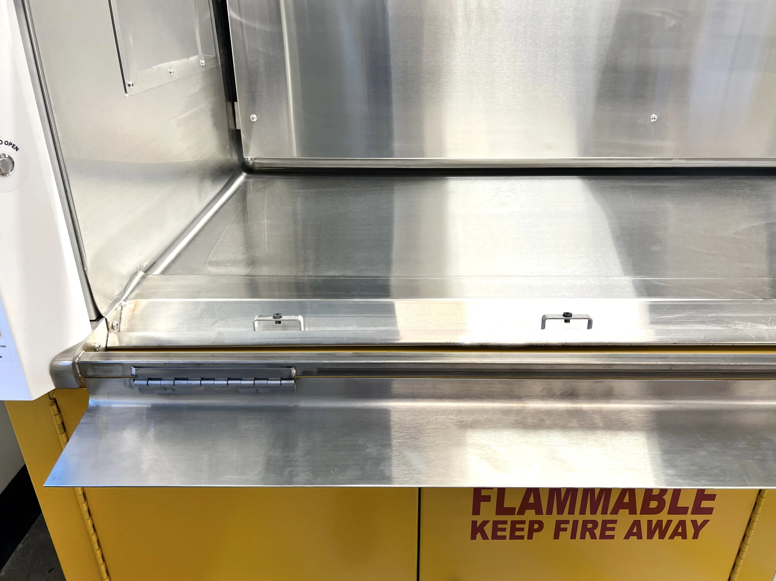 Inside a SafeGuard fume hood with a Stainless Steel Seamless Liner and Integral Work Top and flush sill opened