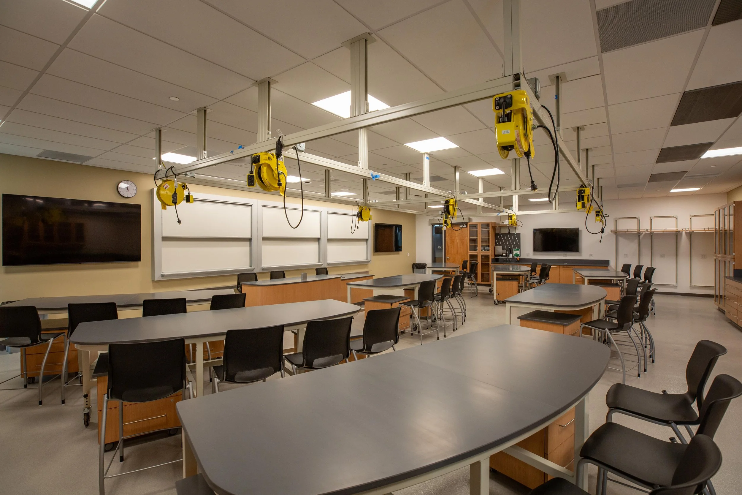 lab tables, wood casework, and chairs, in a lab