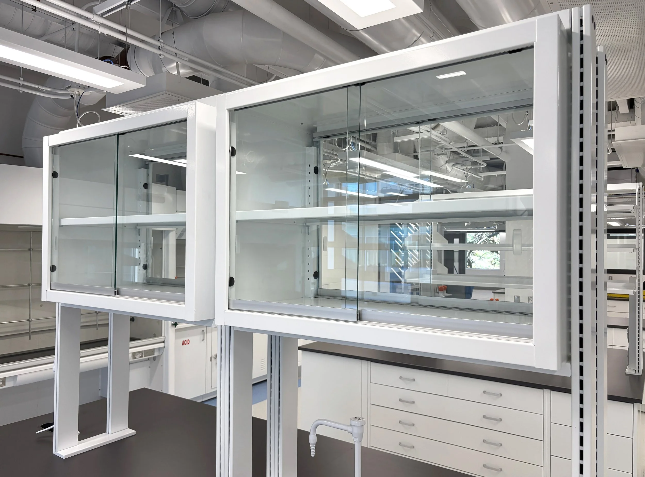 benchtop shelving with double sided glass wall cabinets, in a lab