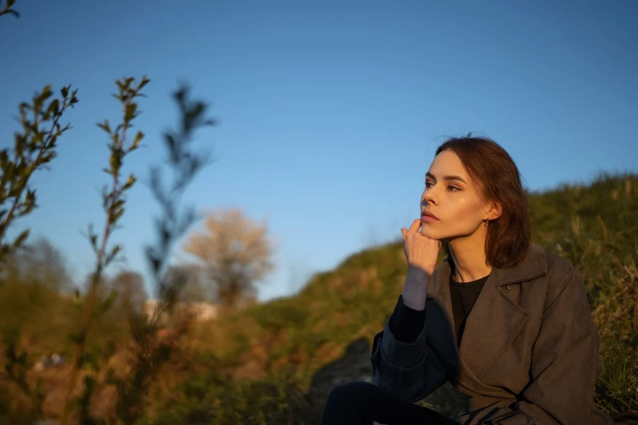 girl-sitting-on-a-hill