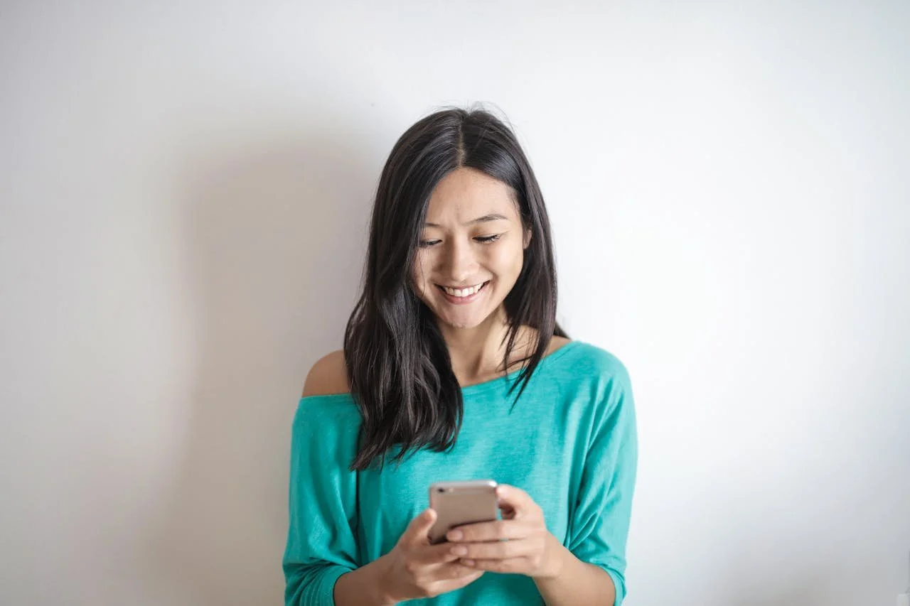 photo-of-woman-using-mobile-phone