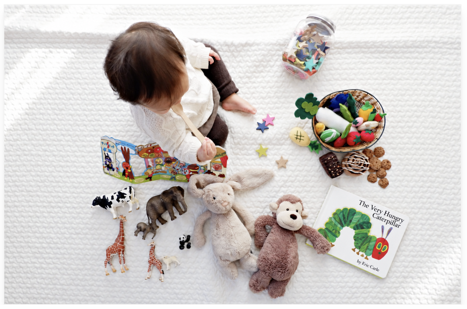 9 Month Old Child on Blanket with Soft Toys