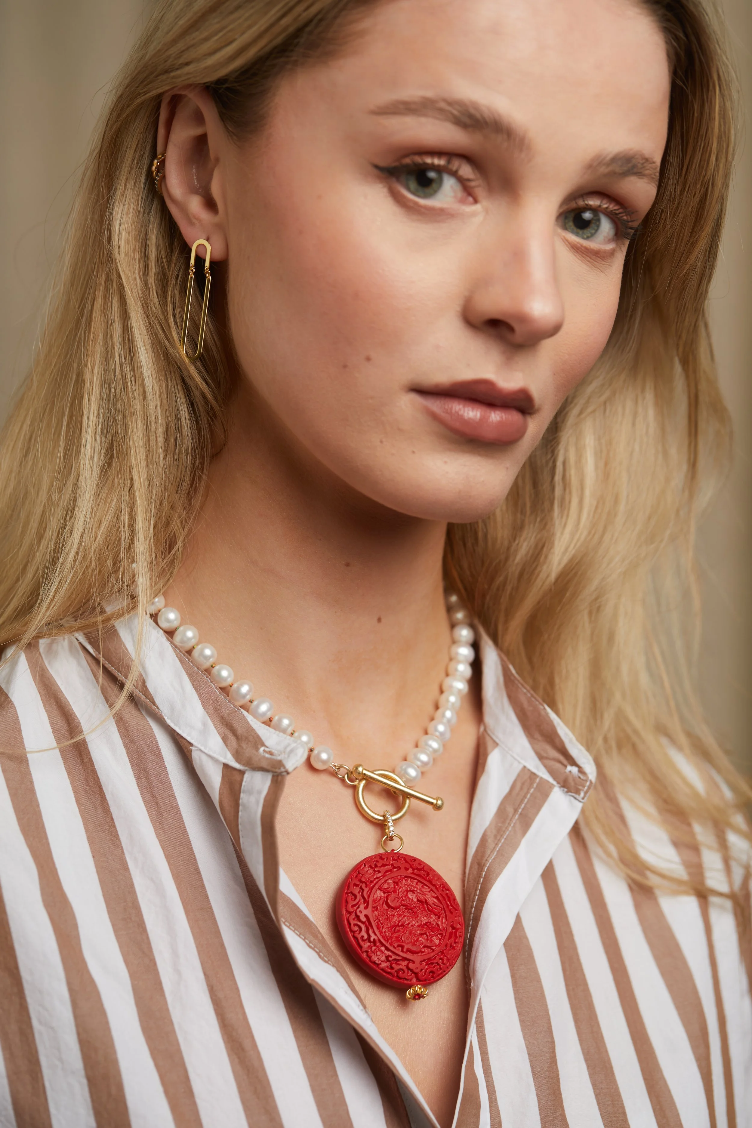 Pearl NK with Red Cinnabar and Hinge Er on model.jpg