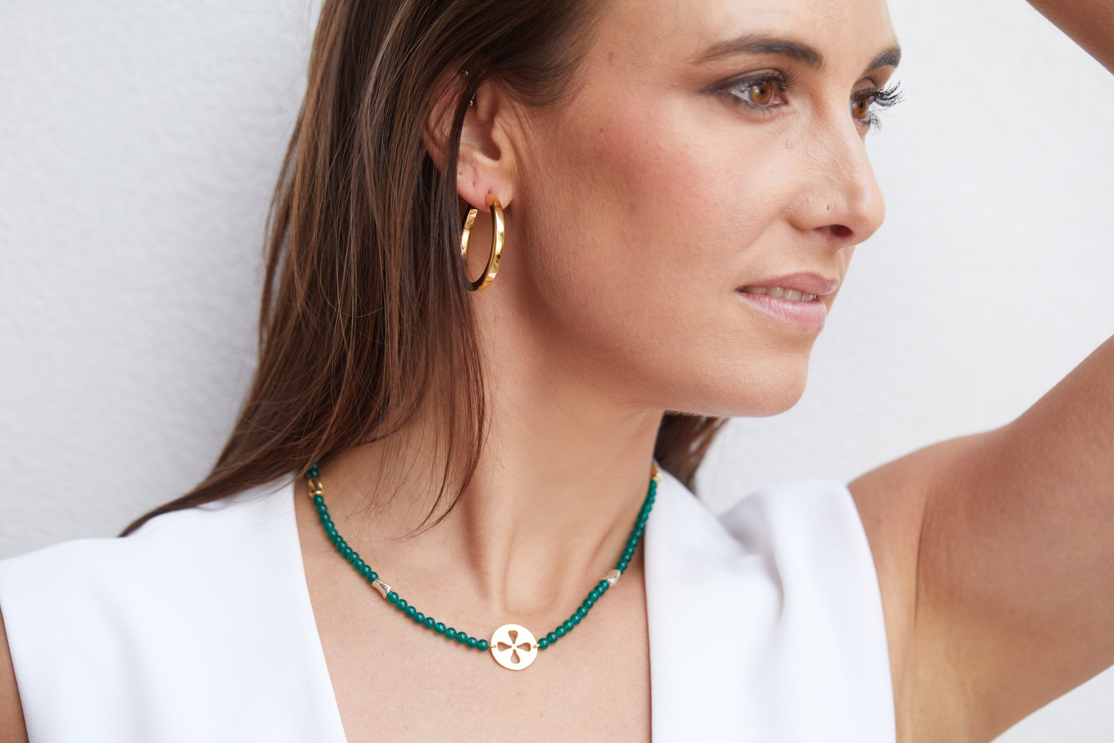 Green Agate Twist Nk with Symbol and Gold hoops on model.jpg