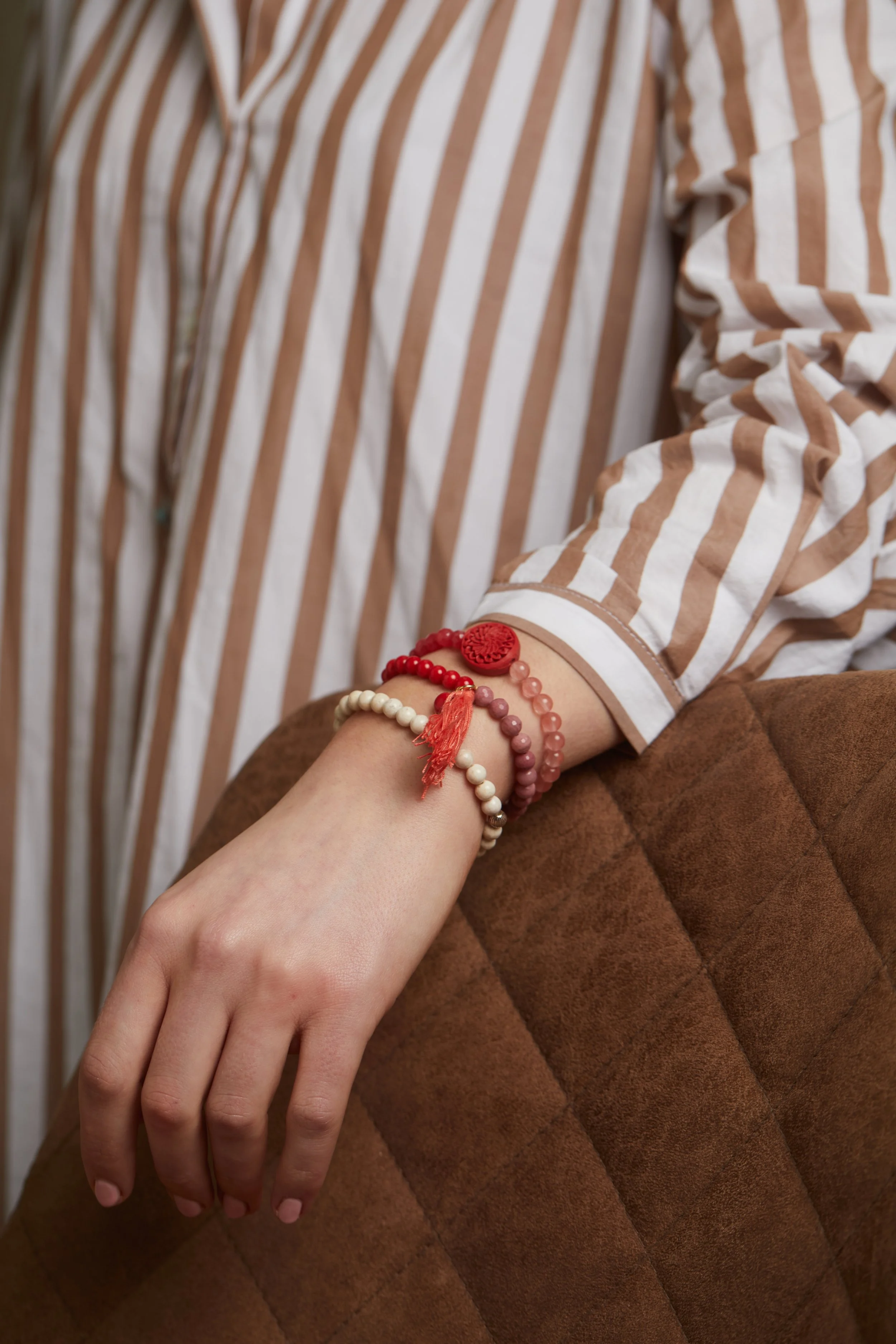 Red Tassel Br on Hand.jpg