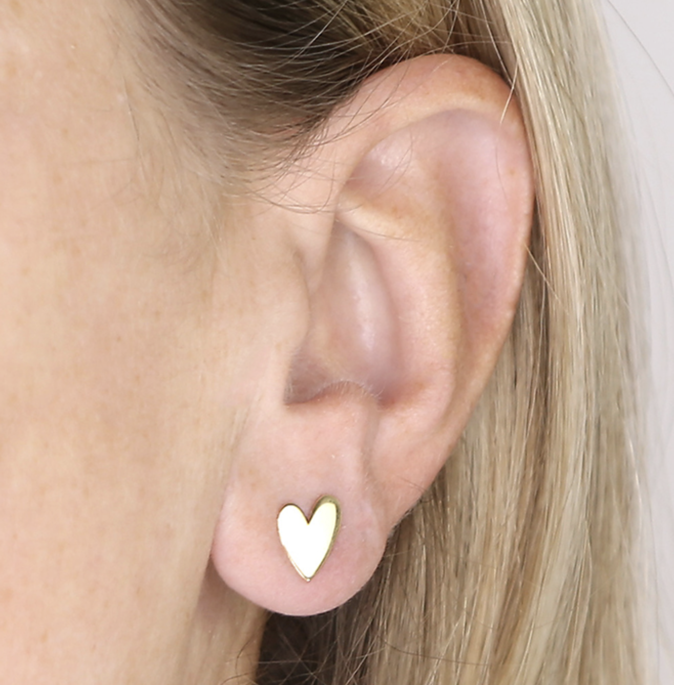 Flat Heart Stud ER in gold on model.png