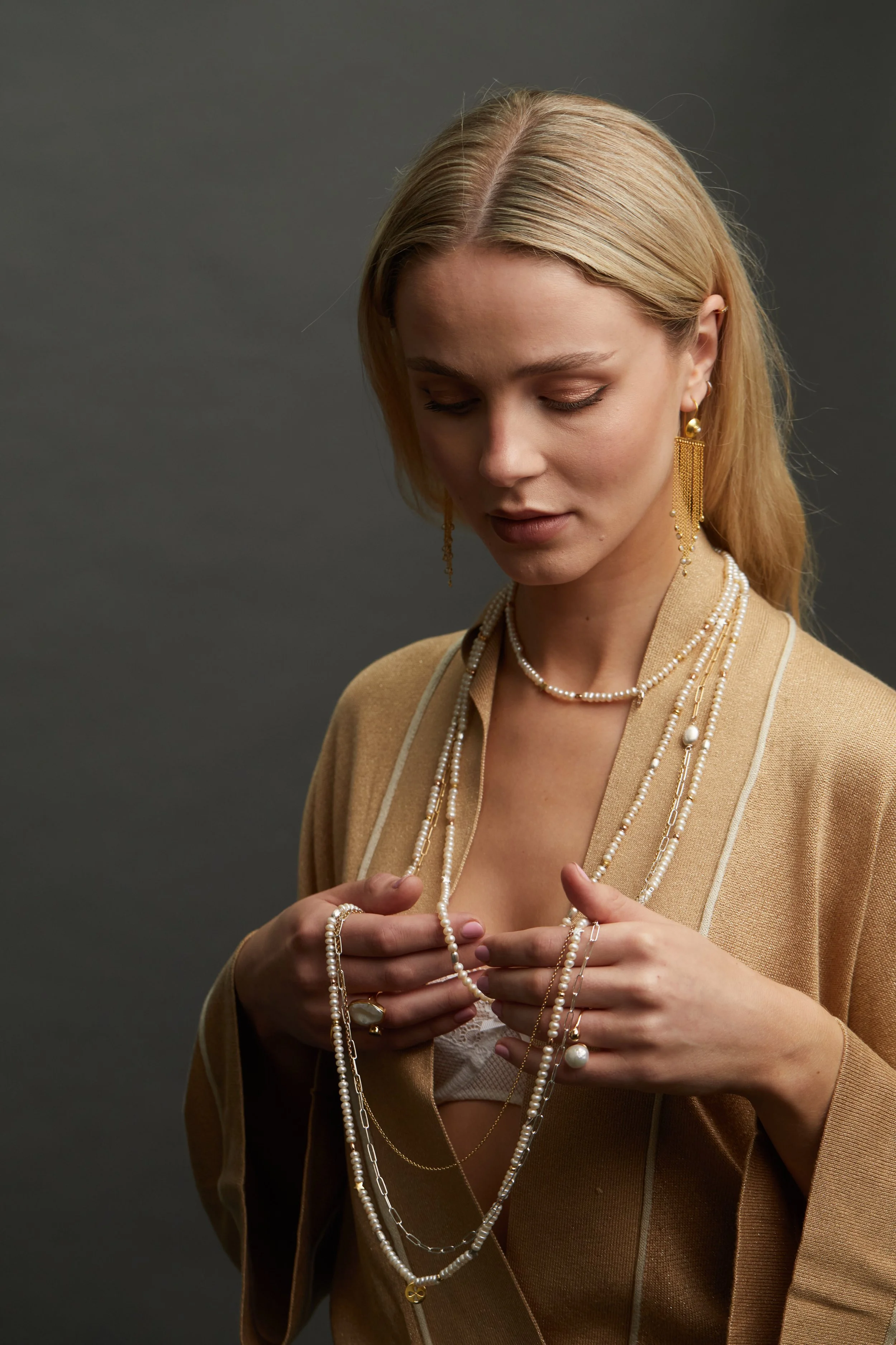 Pearl Ropes layered and Endeka Pearl Er and Pearl Rings on model.jpg