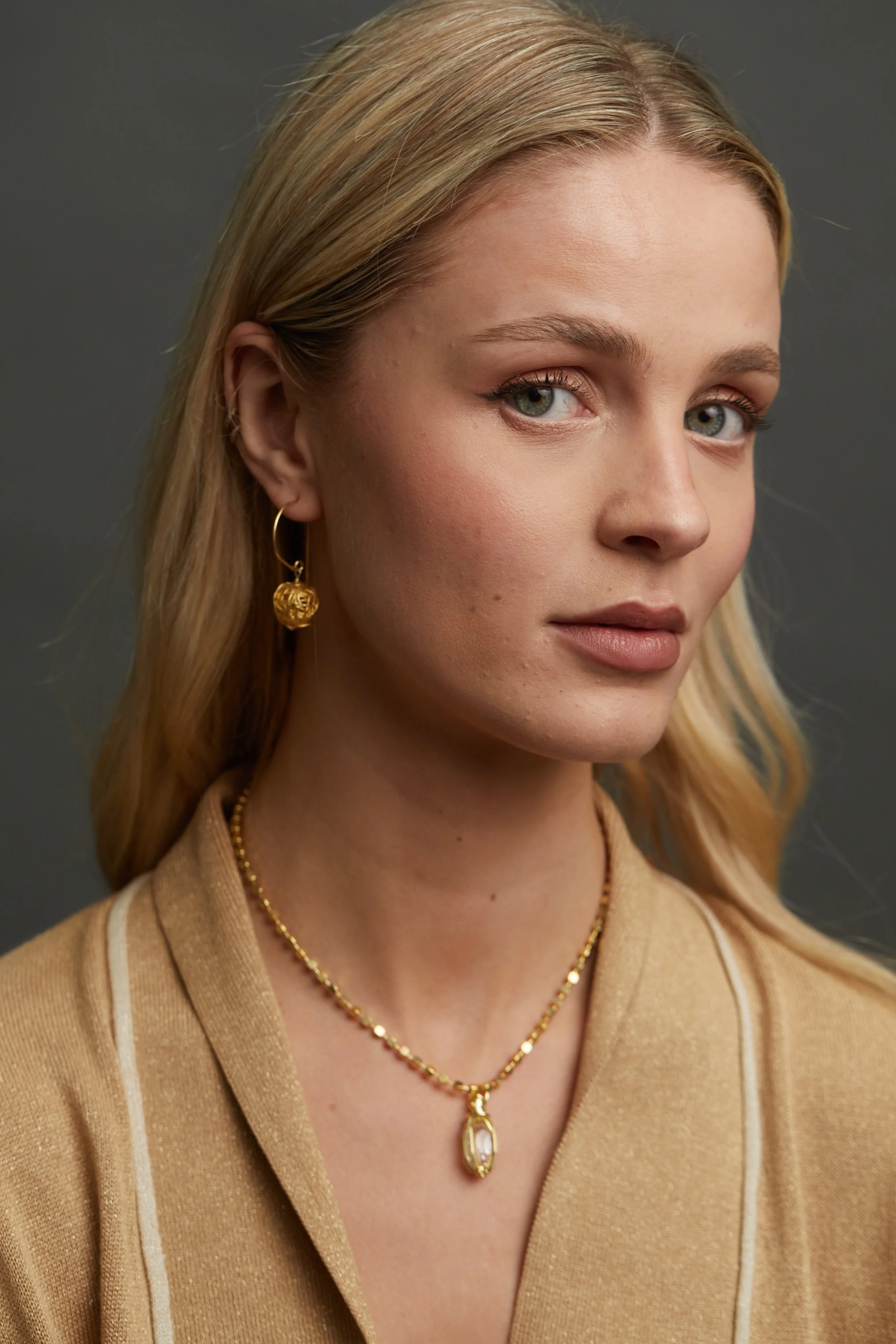 Gold Knot Hoop Er with Heritage Cube NK on model Portrait.jpg