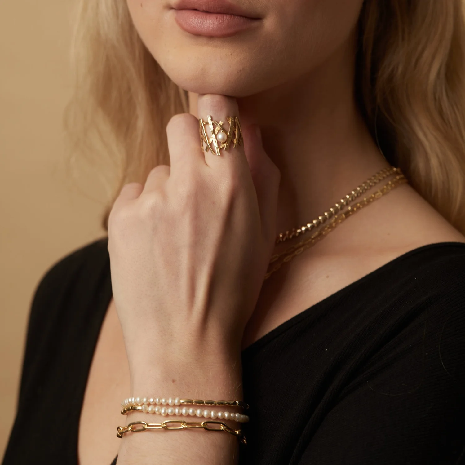 Criss+Cross+Pearl+Ring+and+pearl+beaded+two+strand+bR+and+Paperclip+BR+on+model.jpg