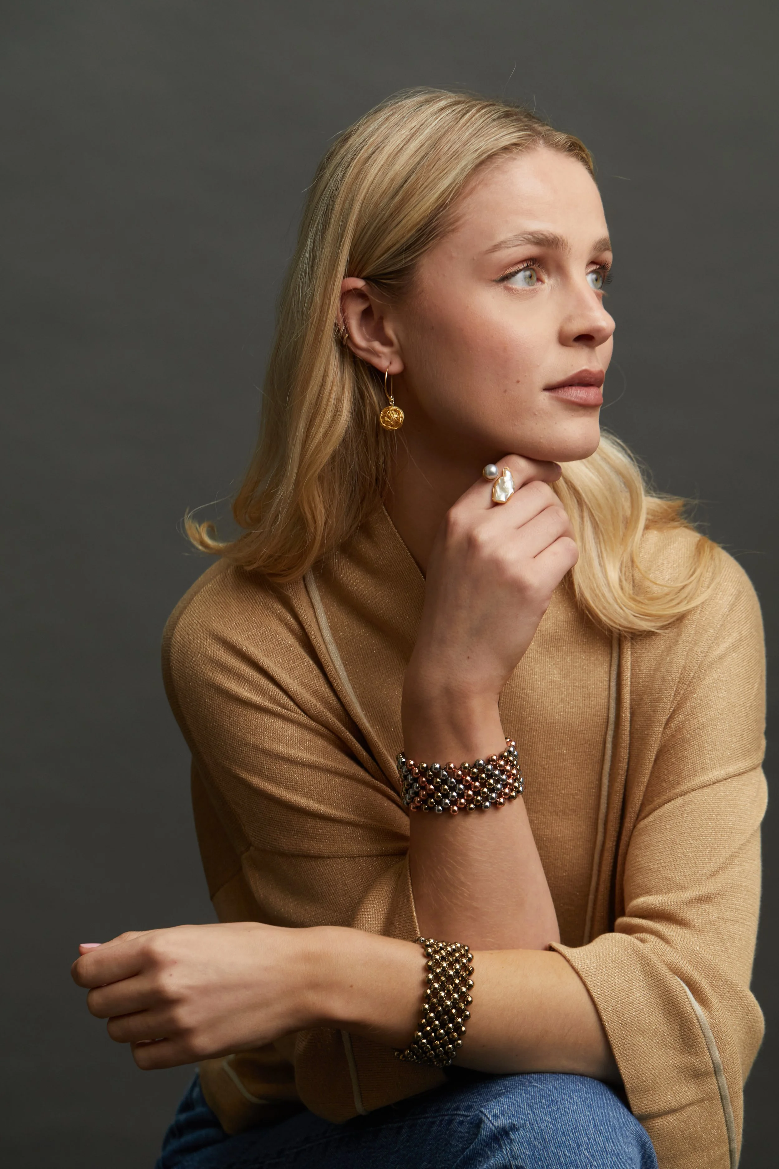 Gold Knot hoop Er and Pearl Ring with Zip Metallic Cuffs on model.jpg
