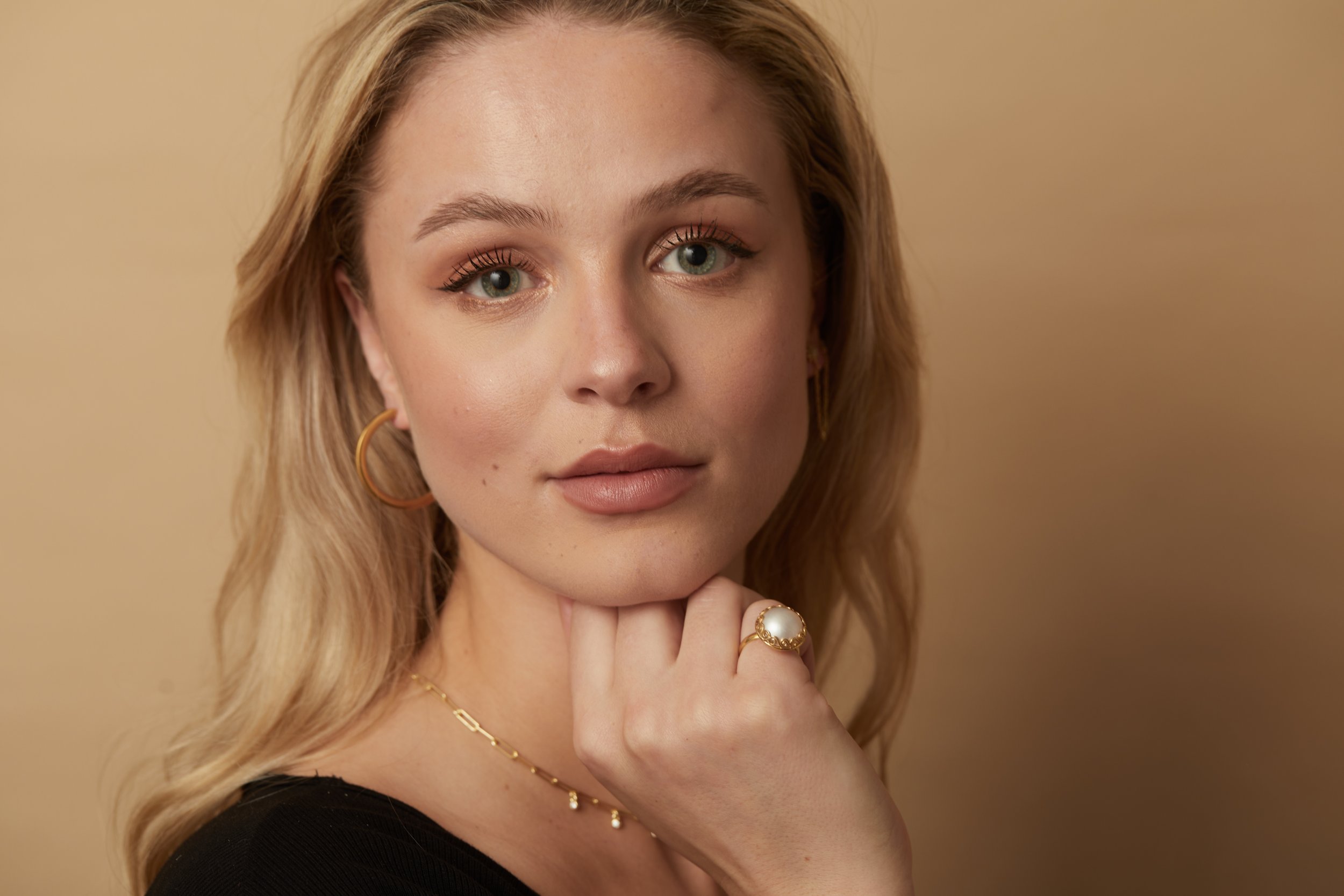 Lace trimmed pearl ring on model.jpg