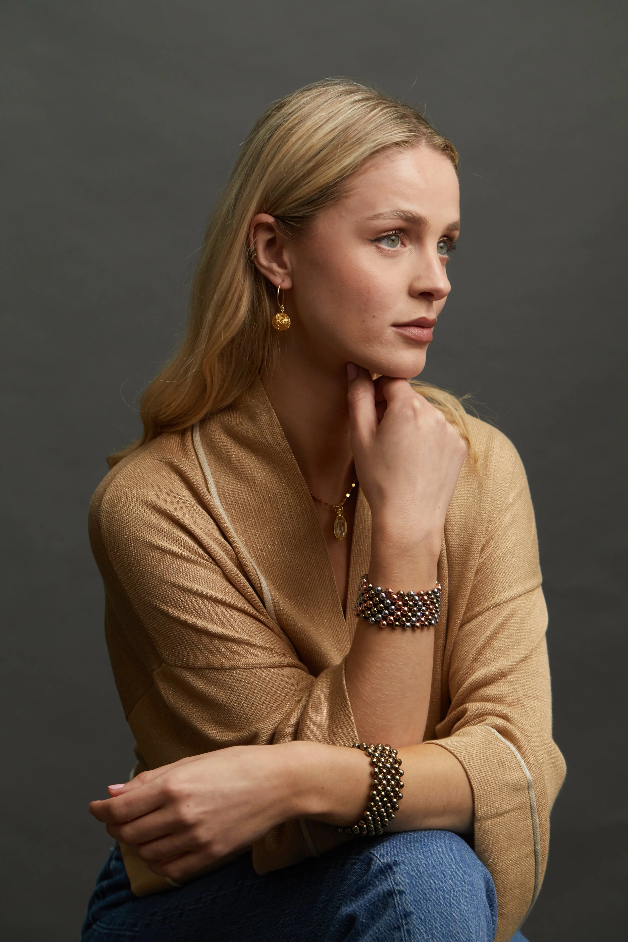 Metallic Cuffs on model sitting.jpg