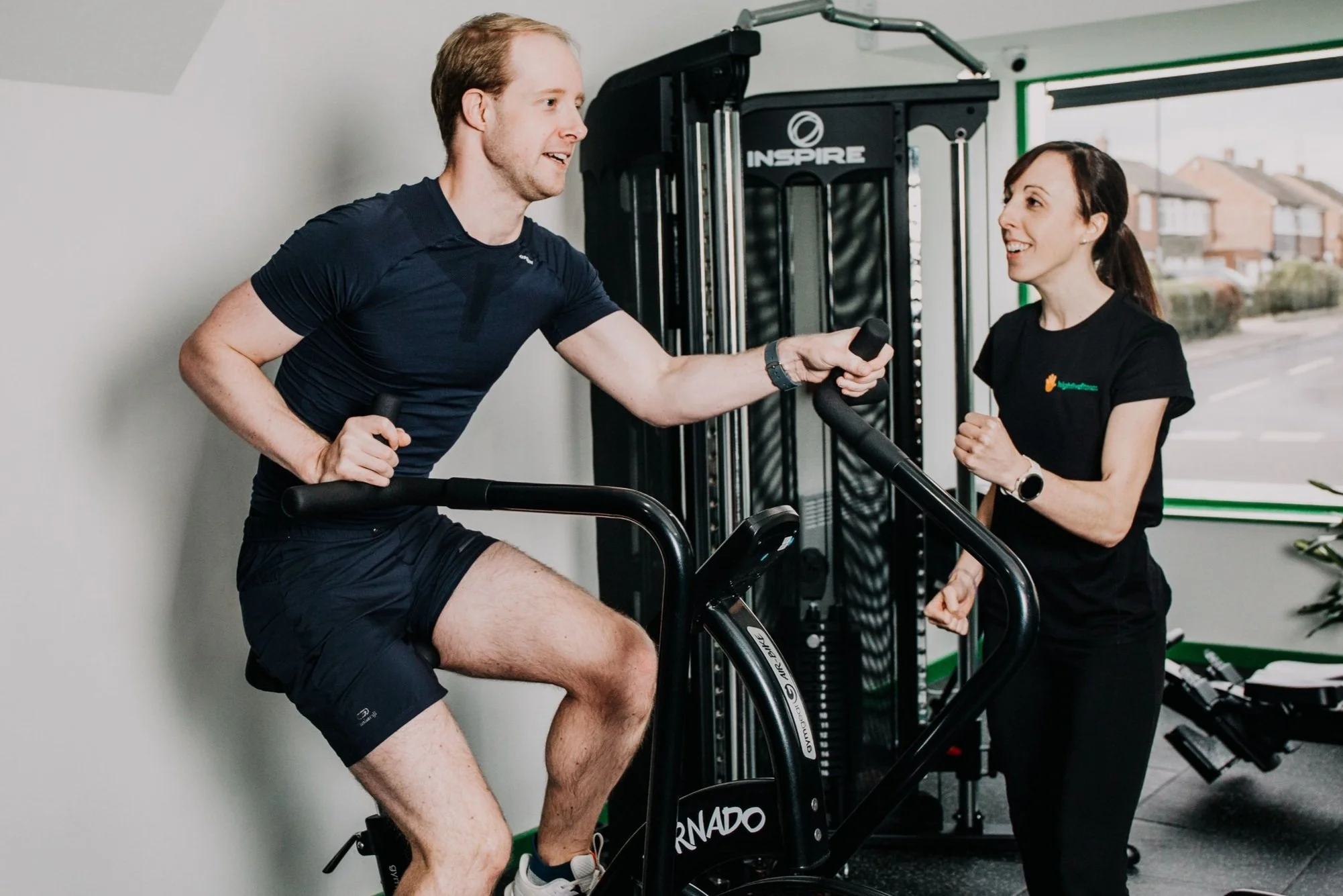 A client using the Air Bike at Highfivefitness
