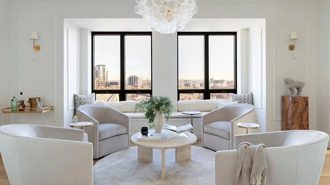 Some lighting fixtures perfectly fit into a space, not because they match or look pretty, but because they speak the same language. In this condo remodel, it echoes the curves, the facets pick up the texture of nearby reeded glass, and it serves as a