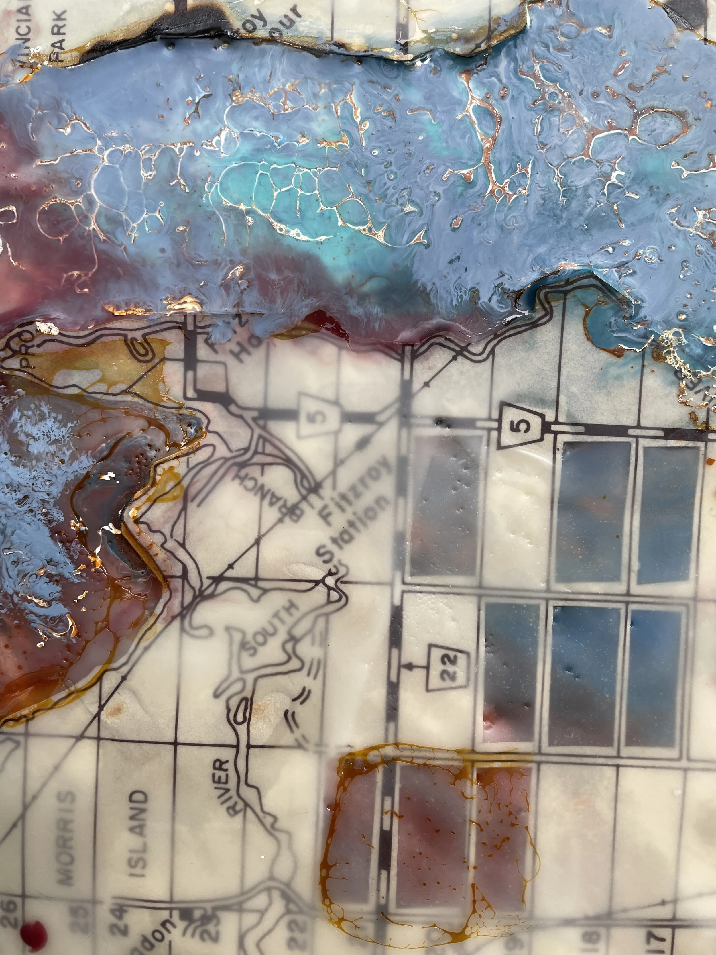 Detailed view of River Logic with textured beeswax shellac burn and preserved vintage map markings beneath blue pigment.