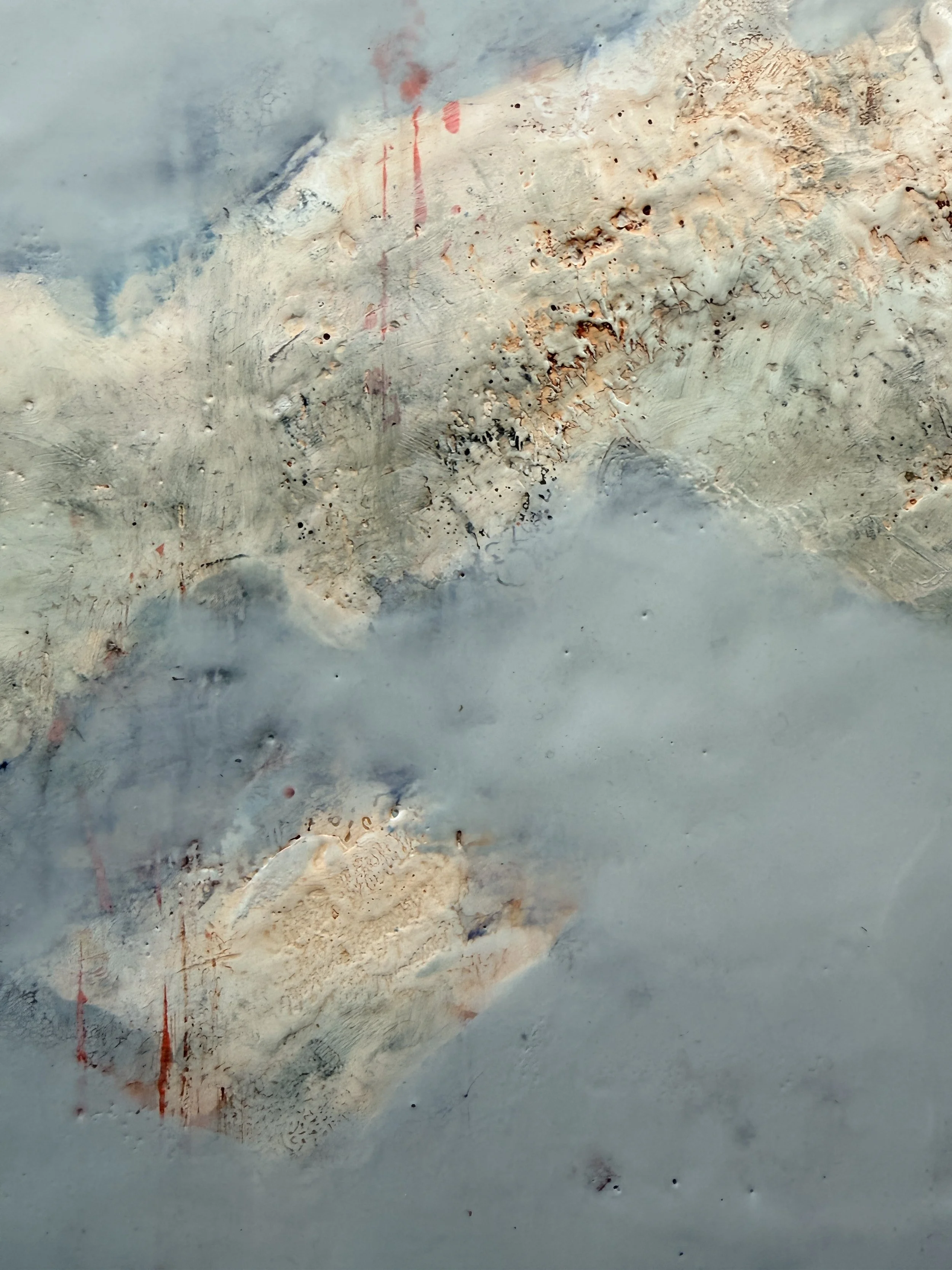 Detail view of Cloud Drift Atlas with soft blue encaustic wax, cloudy white forms, warm neutral texture, rust-red marks, and organic abstract landscape movement.