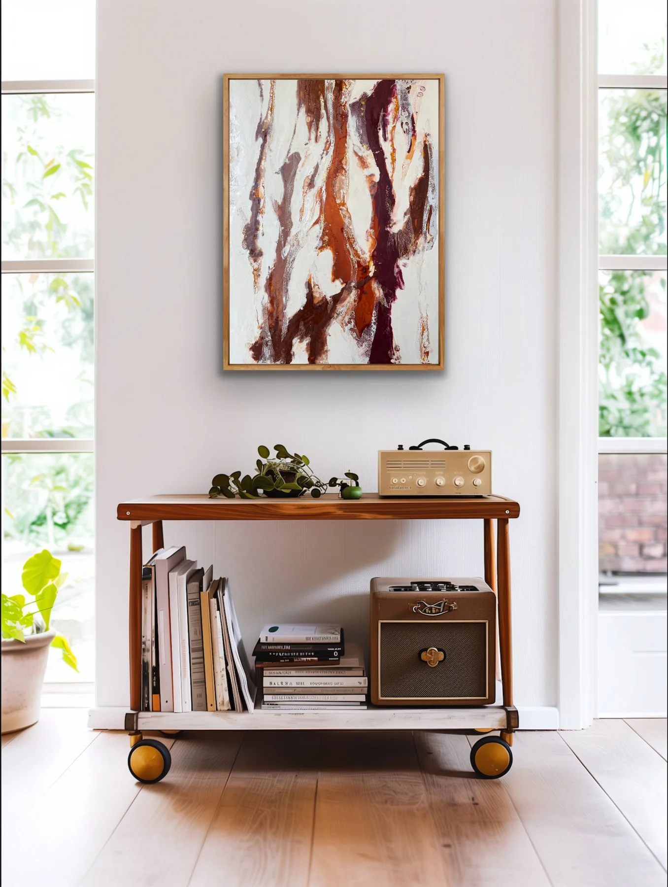 Earth Memory encaustic abstract painting displayed above a console table in a bright contemporary room with natural wood accents.