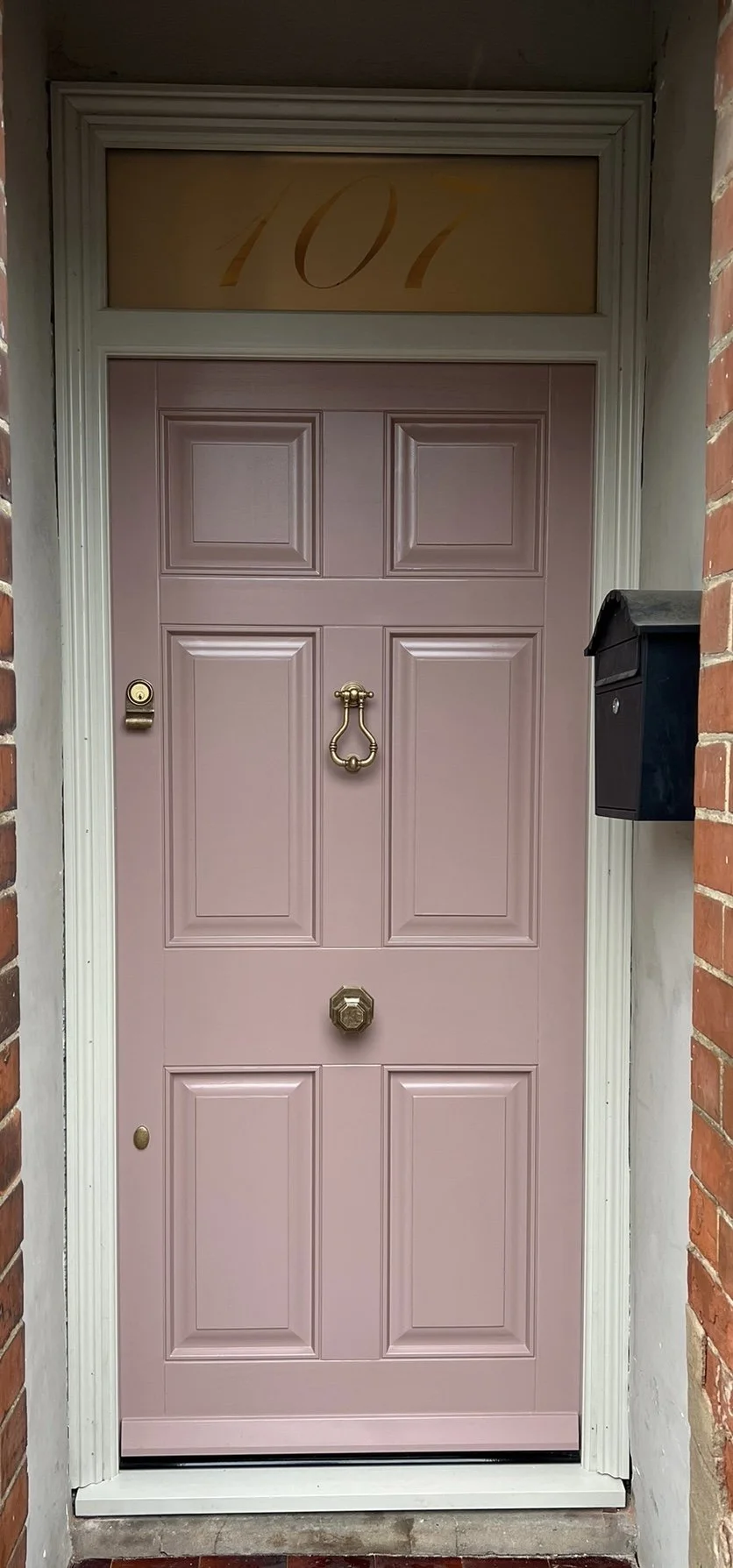 Victorian inspired bespoke high performance sapele front door and frame with triple panels & etched glass fan light. Fully finished in farrow and ball sulking room pink with brass hardware from Jim Lawrence 