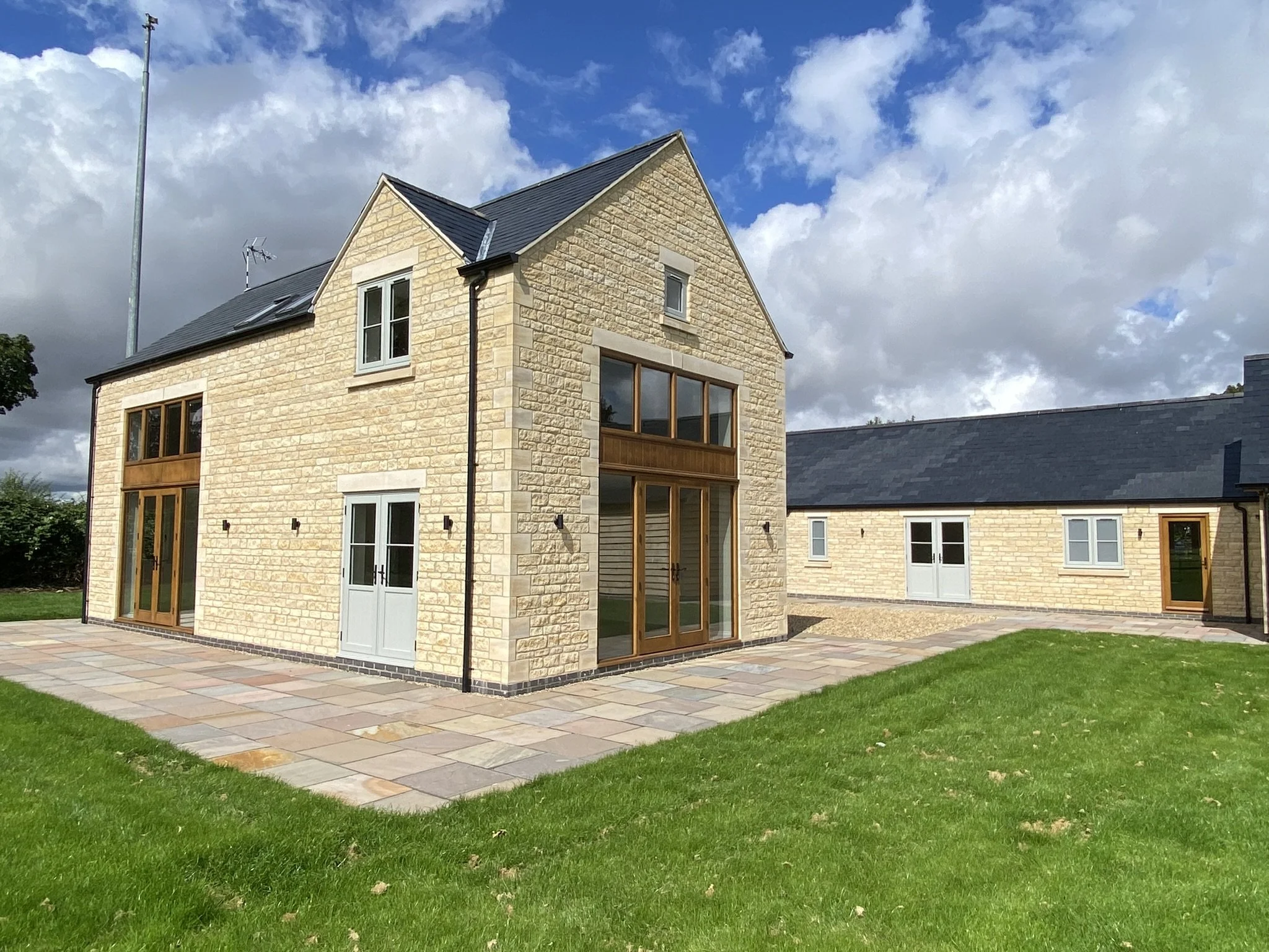 Bespoke prime european oak, high performance French doors with black hardware, fully glazed side lights and feature window all finished in a light oak stain and clear topcoat. 