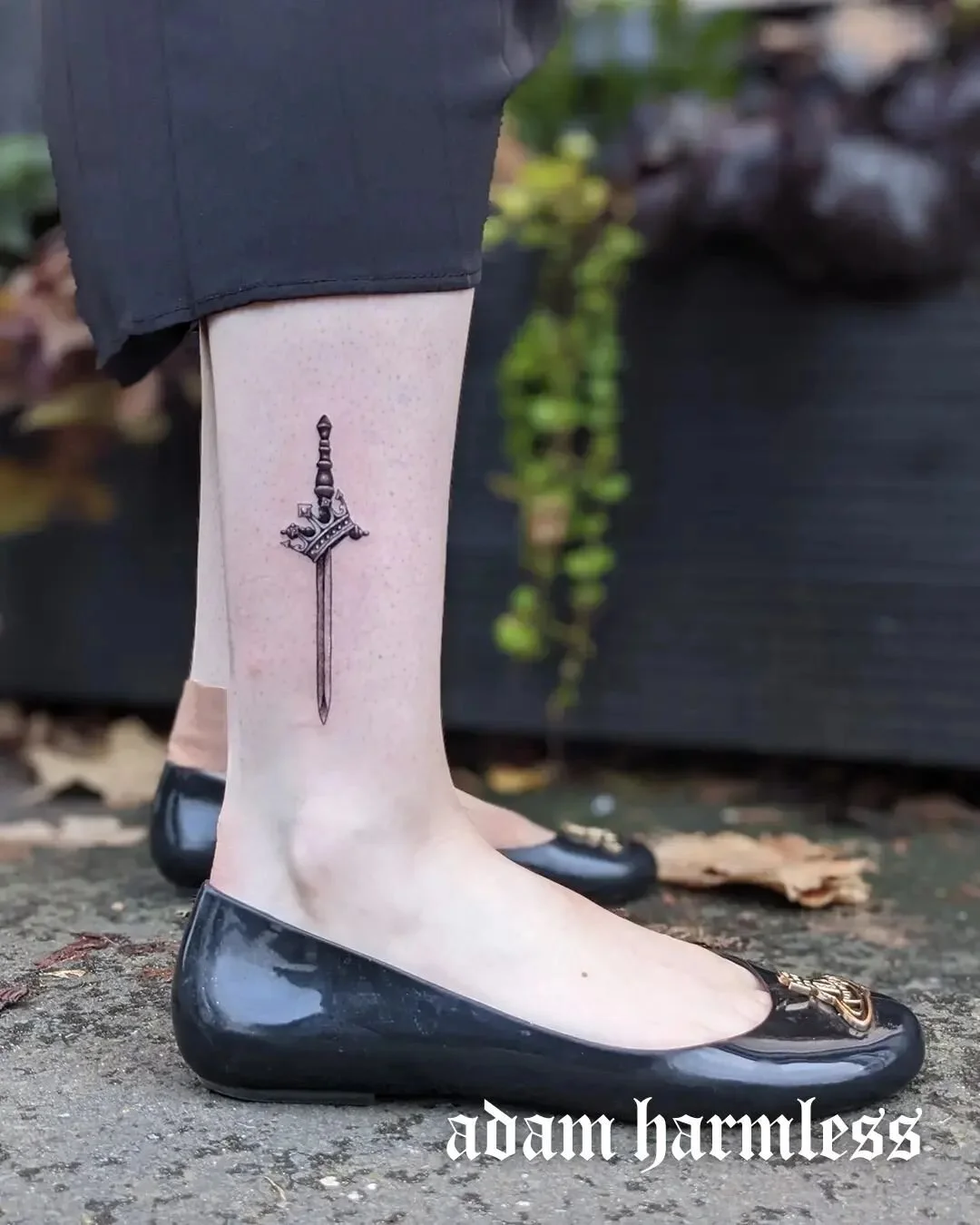 A TEENY TINY sword and crown combo for Lara :) SWIPE FOR A CLOSEUP!⁠
.⁠
Eco-conscious and Vegan tattooing 🌱💚⁠
Based at @harmlesstattoo⁠
For enquiries, please email hello@adam-willett.com or visit www.adam-willett.com⁠
.⁠
 #blackwork #tattoo #blackw