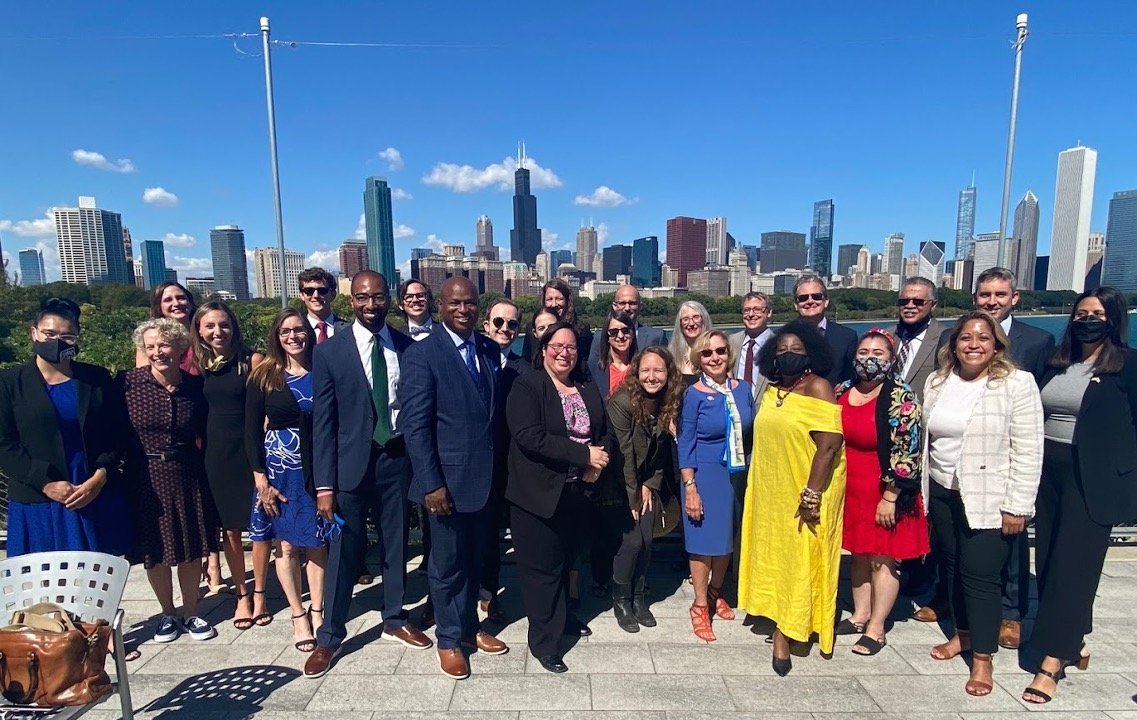 Caption: At the signing ceremony, a few representatives of the thousands of people who put in thousands of hours of organizing, writing, educating, lobbying and putting pressure on their elected officials to pass the bill.