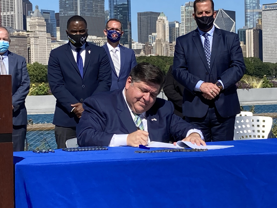 Caption: The governor at the official signing ceremony.