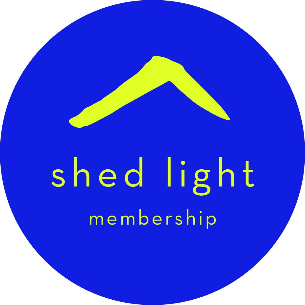 Blue circular logo with a yellow mountain-like shape and the words 'shed light membership' in yellow text.