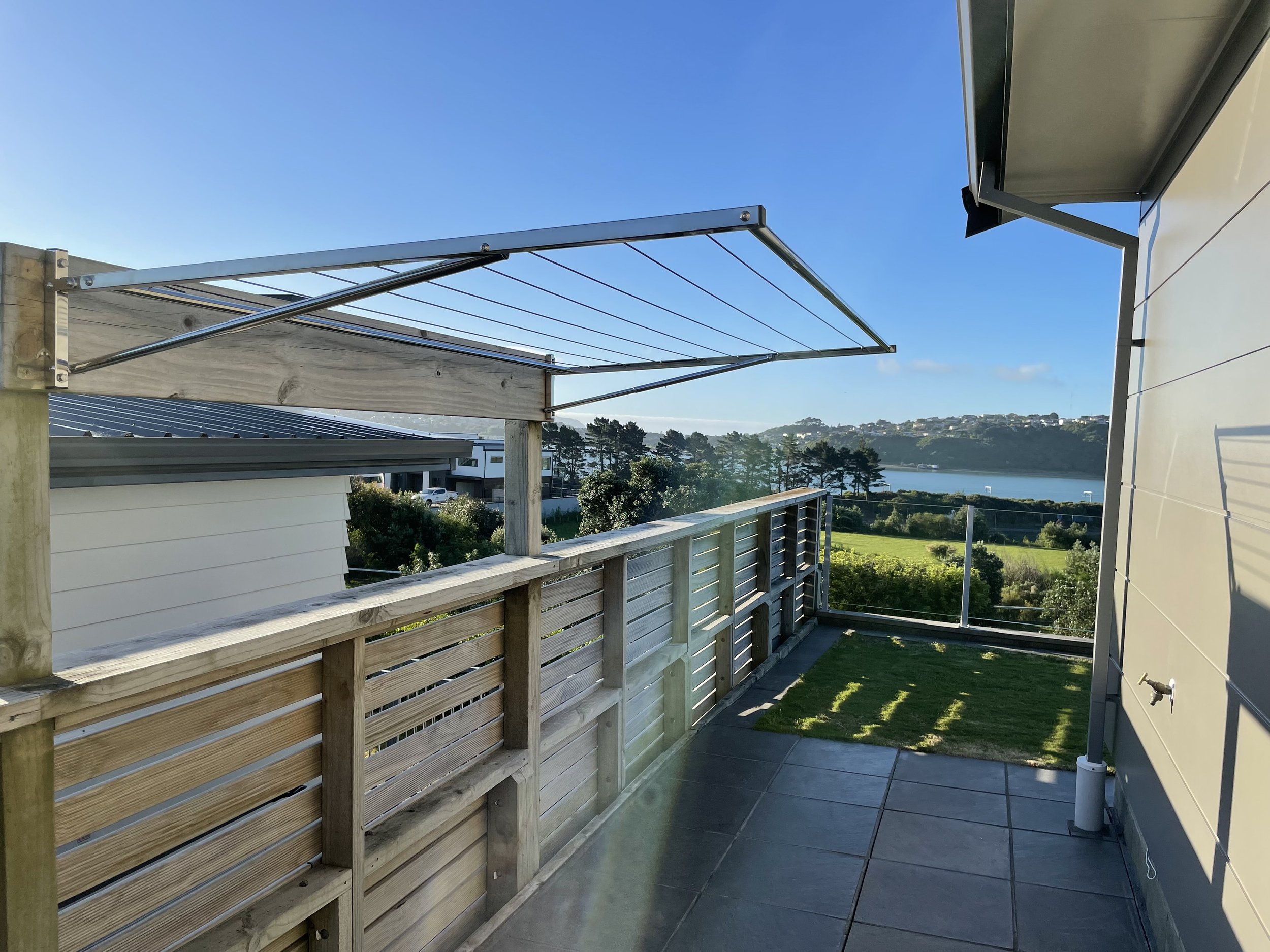 Wall-mounted Polished Stainless Steel Clothesline mounted on wall