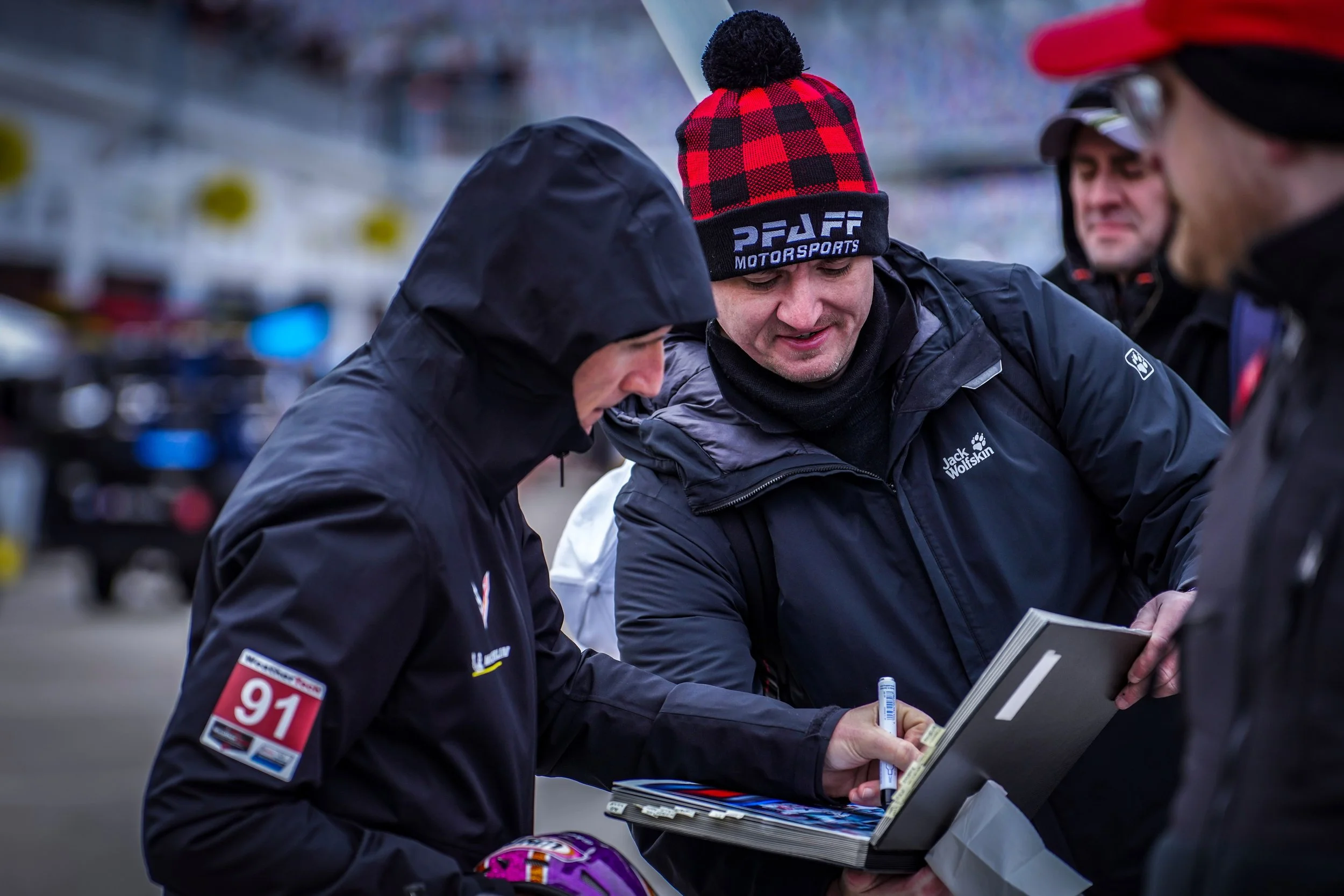 Ben Keating signing an autograph for Pfaff Motorsports