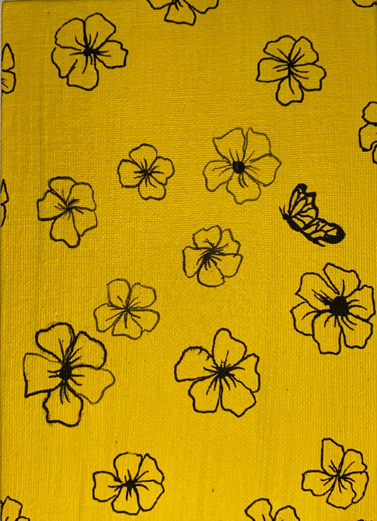 Yellow fabric with black outline flowers and a butterfly design.