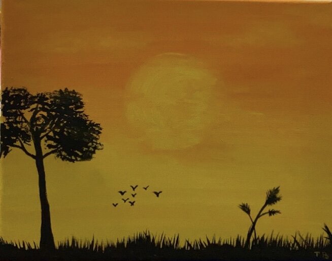 Silhouette of a large tree, smaller plants, and a group of flying birds against a sunset or sunrise sky with a large sun.