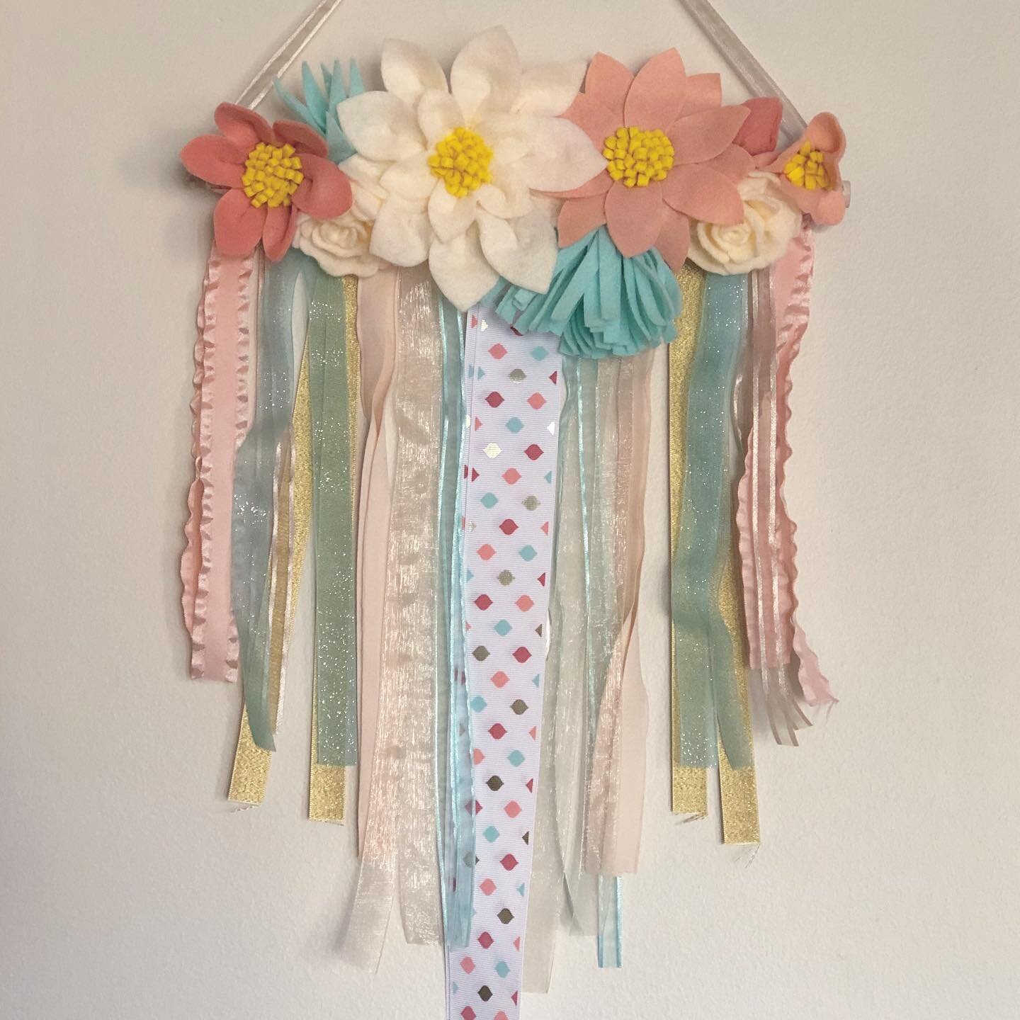 It&rsquo;s never too early to start holiday shopping!! 🥰 
.
🌸 Felt flower and ribbon wall hanging!
.
🌼 24&rdquo;x12&rdquo;
.
🌺 $35.00
.
.
.
Message me for custom orders!!
.
.
.
#ShopSmall #ShopLocal #Handmade #Homemade #MadeWithLove
