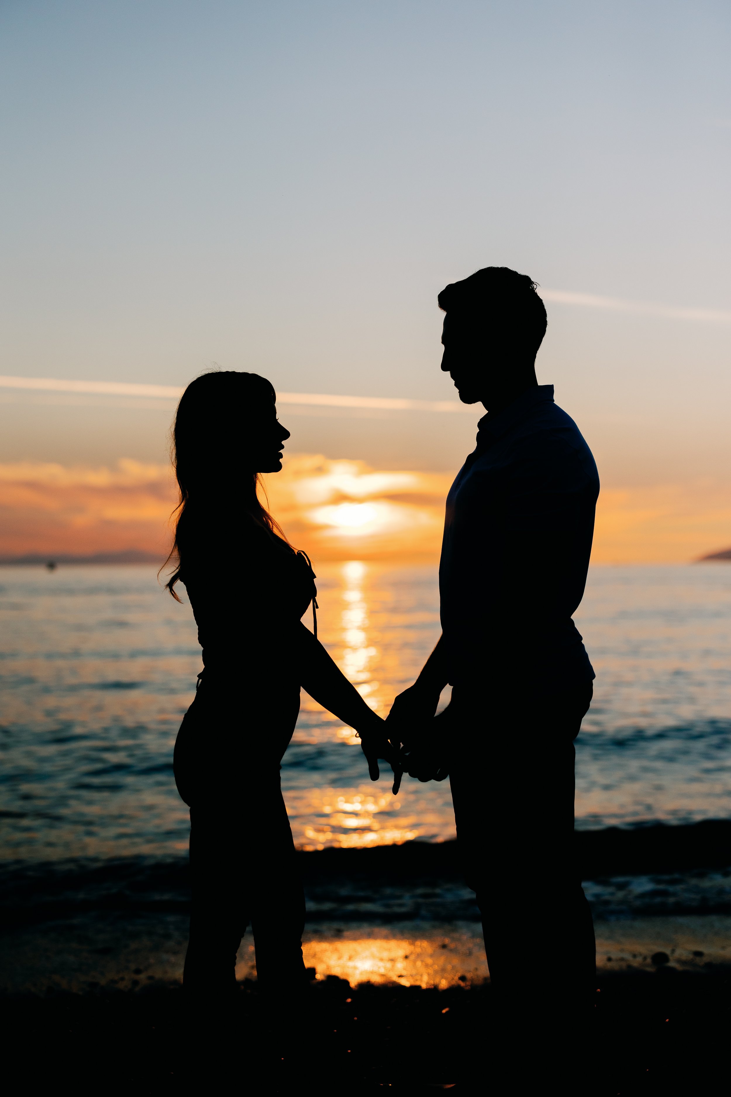Capturing Love's Golden Hour: A Mesmerizing Engagement Session at Ambleside Beach with Rachel and Jonathan
