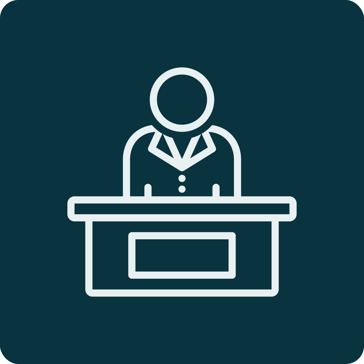 Line drawing of a person sitting at a desk, representing a professional or office worker.
