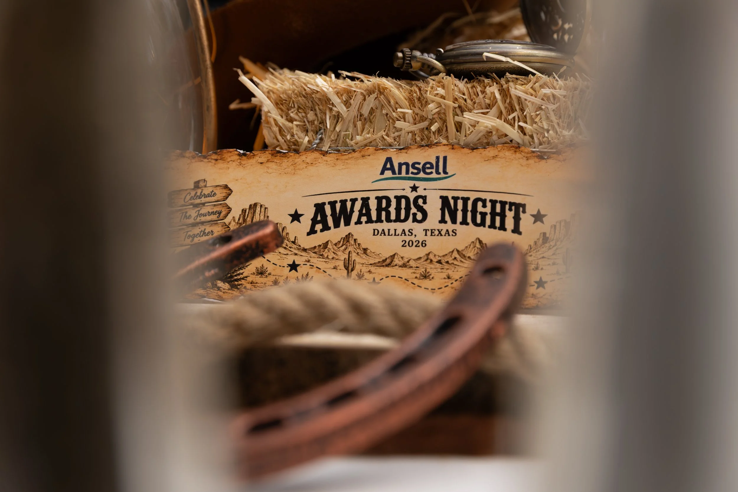 Close-up of a straw cowboy hat with leather band and Ansel Awards Night Dallas, Texas 2026 event tag.