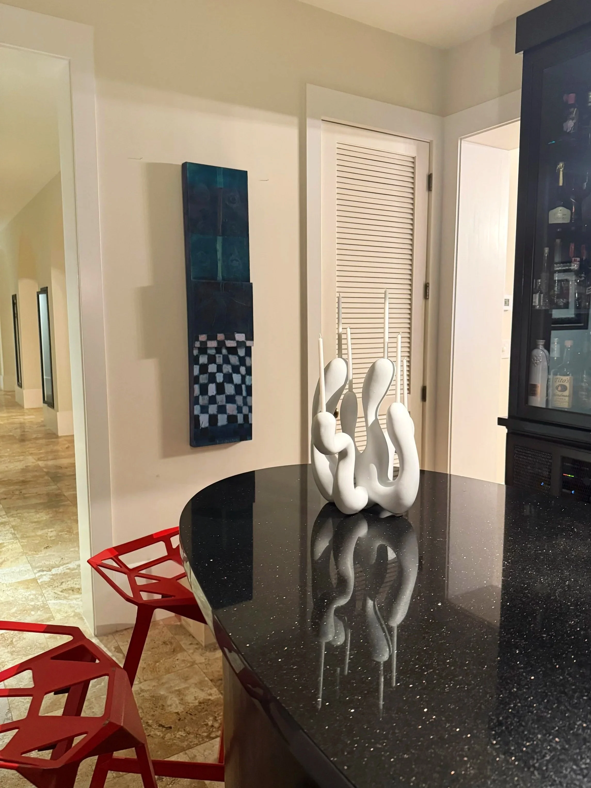 white candleholder on a marble countertop